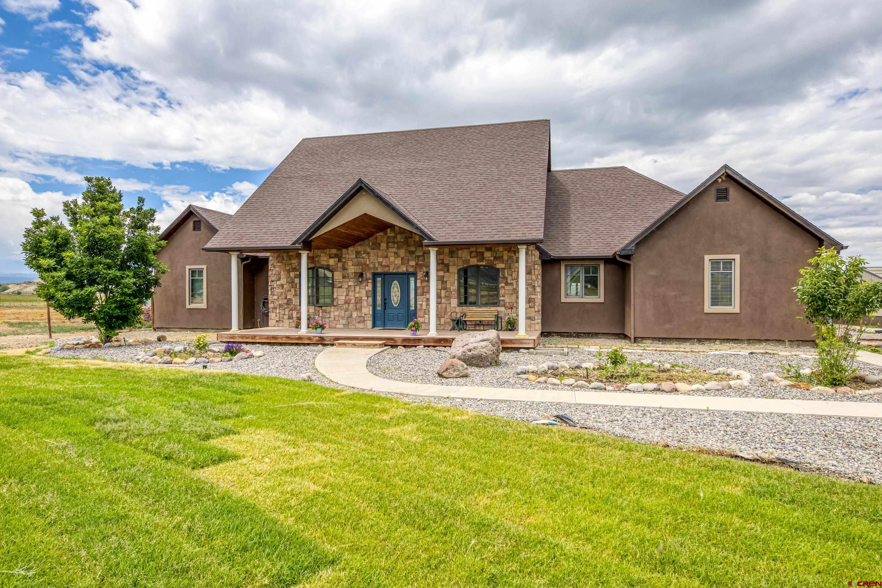 Country Living is what you get with this remarkable custom home that had brand new Granite Countertops installed in the kitchen and the bathrooms have been completely remodeled. Also included is an oversized two car detached garage/shop with a walk-in closet that is plumbed for a bathroom. There are 6.3 shares of irrigation through the HOA and the property offers a small pond. Come see this beauty for yourself which sits on 11.62 acres. NO Covenants!
