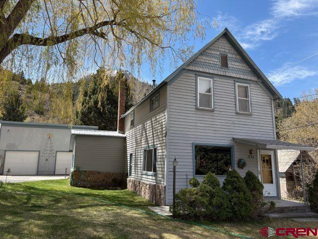 Come see this opportunity to own a nicely reconstructed home in Ouray, in the highly desirable R-2 zone district. This classic Ouray home has been thoughtfully retrofitted with modern plumbing, electrical and forced air heat. A detached 2 car garage could be remodeled or replaced with an ADU. Mature trees including: plum, apricot , peachcot, cherry as well as large, mature shade trees adorn the yard. High-speed fiber internet as well as Dish Network and Direct TV allow for great connectivity.  The home is fully functional and in good operating condition for a quick move in. With moderate effort, there are real possibilities for a significant remodel that would not involve any structural alterations.  A basement allows easy access to the Natural Gas furnace, plumbing and electrical. It also provides significant storage. The home is heavily insulated and well suited for the Ouray climate.  Primary views are toward the Amphitheater, other views both north and west are visible from numerous rooms.  The exterior is low maintenance with a Pro Panel roof and Masonart siding. Zoning is key and a real value add.