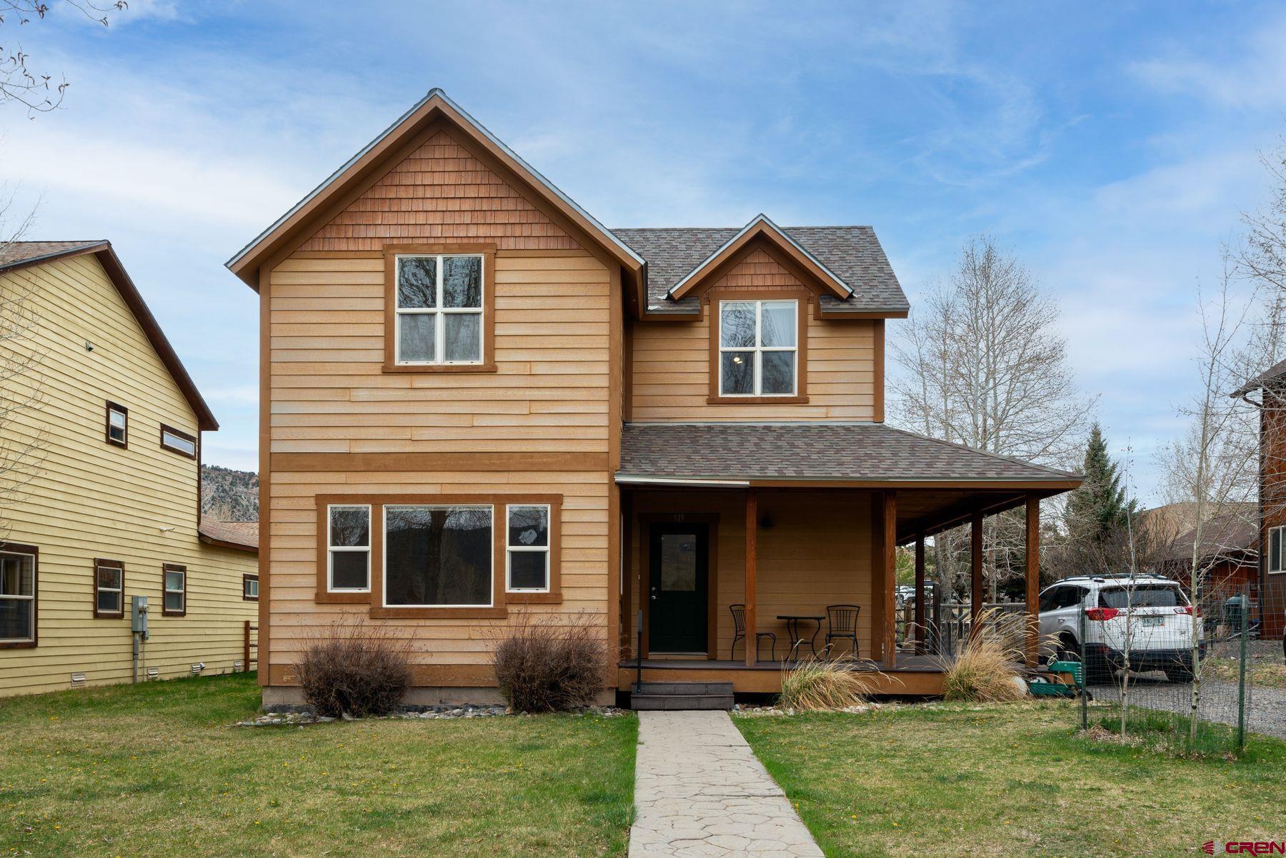 Spacious 4-bed/3-bath home characterized by large rooms and bright spaces and a separate 2-car garage with a 1-bed/1-bath guest house above it. Located on a leafy street in one of Ridgway's most vitalizing neighborhoods. Parks and river trails and public lands are all just steps from the front door, as is the nascent cultural scene of this ideal Colorado community. The home welcomes you into a south-facing and open floorplan with a kitchen and pantry providing ample storage. A wraparound porch and a big backyard expand the living spaces outside. The primary suite features loads of space, a double vanity, a soaking tub, a roomy shower, and a walk-in closet. The heated garage has two bays and extra storage while the 1-bed guest house above provides a plethora of options to its next owner.