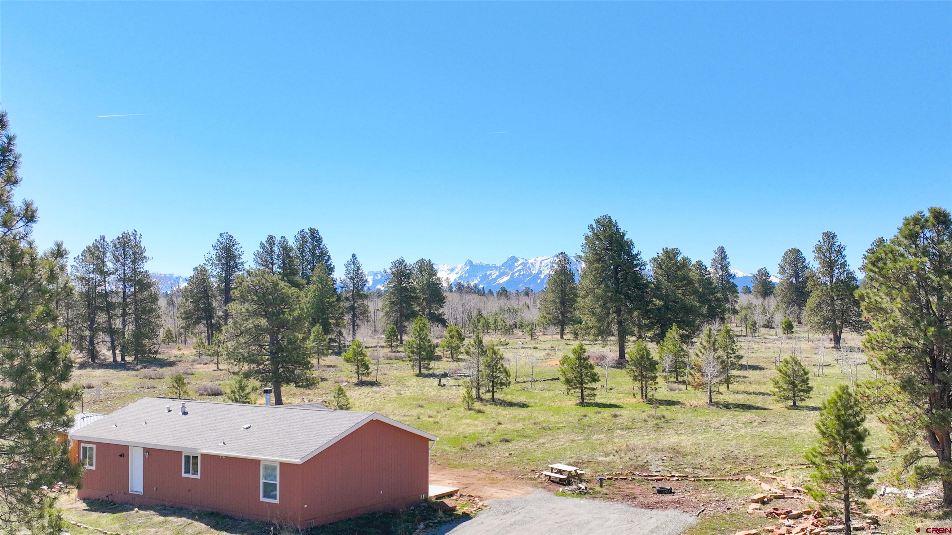 Horsefly Mesa Hideaway – 35 Acres with Cabin, Wildlife Pond & Big Potential in Unit 61  Escape to 35 private acres atop picturesque Horsefly Mesa, where rugged beauty meets off-grid comfort. This 1,350 sq.ft., 3 bedroom, 2-bath cabin offers a turnkey mountain lifestyle with solar power, a reliable Kohler backup generator, a cozy wood-burning fireplace, propane heat, and a domestic well for water.  A large, natural pond is the centerpiece of the property—home to ducks, elk, turkey, and other abundant wildlife. Whether you're dreaming of a hunting basecamp, recreational retreat, or future mountain homestead, the setting offers unmatched potential in Game Management Unit 61, with Unit 62 nearby.  The land is open, usable, and ready for your vision—expand the cabin, add a shop, build a barn, or simply enjoy the serenity as-is. From the property, access thousands of acres of public lands and trails on the Uncompahgre Plateau—ideal for UTVs, ATVs, horseback riding, hiking, or mountain biking.  Located just 35 minutes from Telluride or Ridgway, and 40 minutes to Montrose. Seasonal access adds to the sense of escape. A rare find for those seeking solitude, wildlife, and future possibility in the Colorado high country.