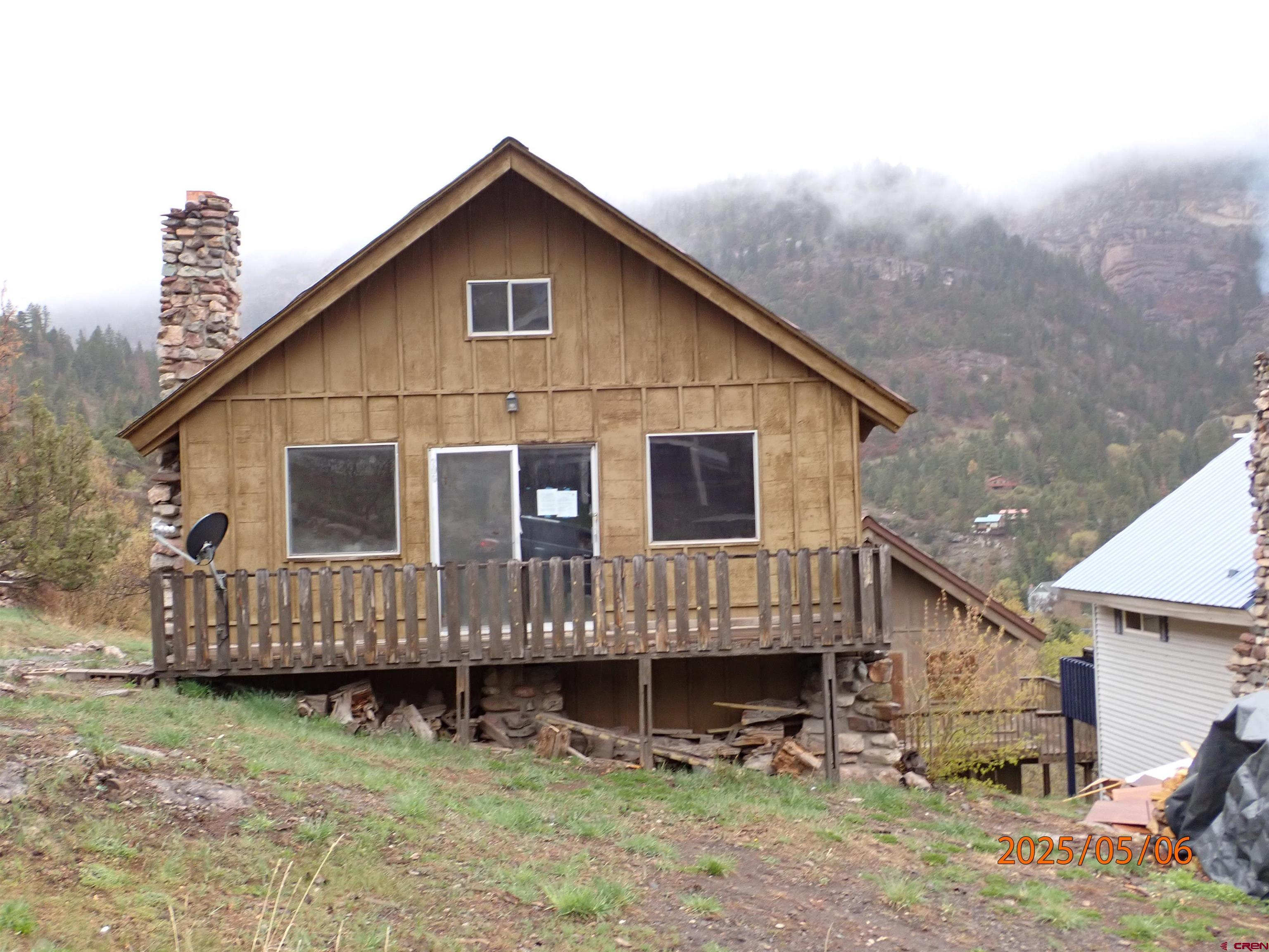 Time to remodel this bungalow and make it your BASECAMP or permanent home in the Historical Colorado Mountain Town of Ouray.  It has one bedroom plus a small loft.  A charming rock fireplace stands in the living room. There is an unfinished basement for storing all your toys to enjoy all that this Mountain location has to offer.