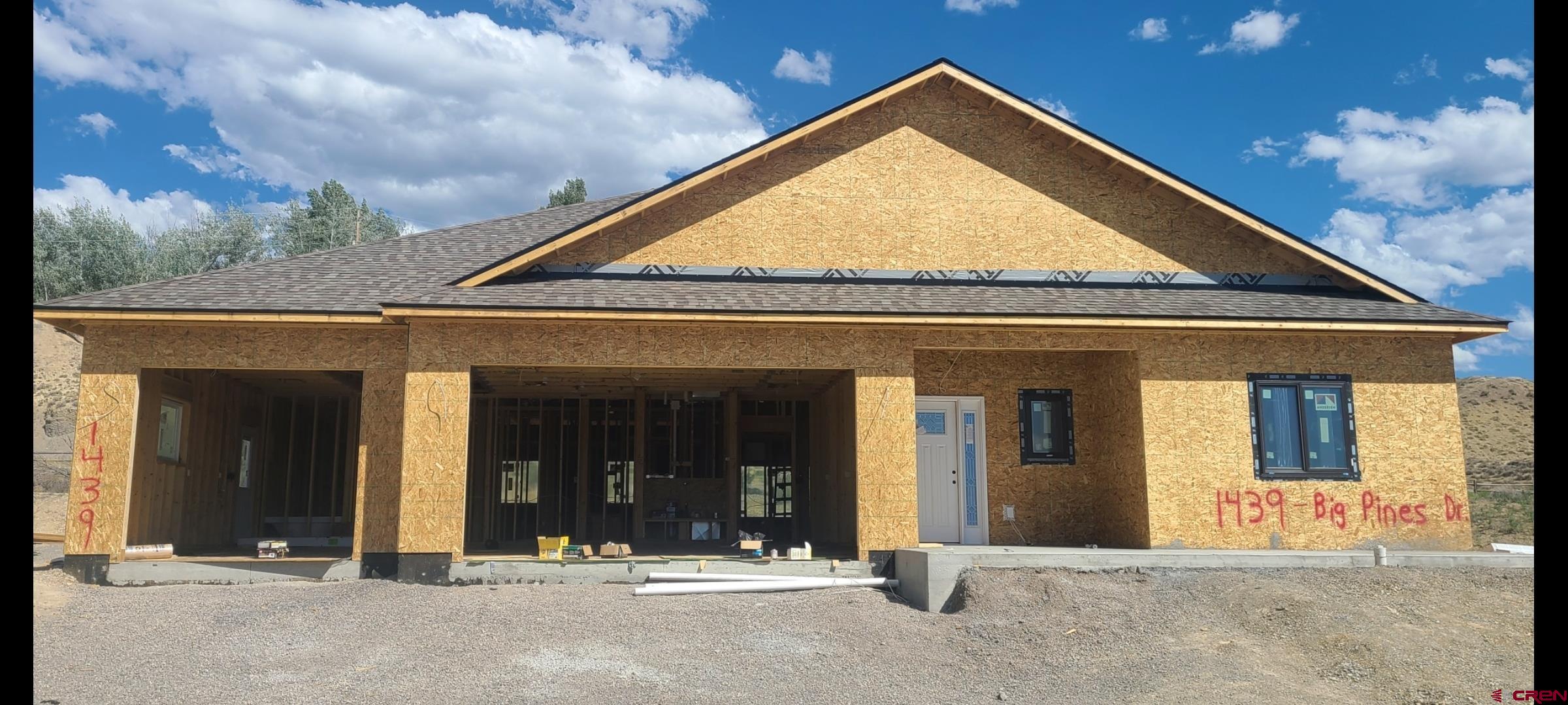 Stunning New Construction – 4 Bed | 3 Bath | 3-Car Garage Wood’s Crossing Subdivision | Built by Uncompahgre Valley Builders, LLC  Welcome to your future home in the sought-after Wood’s Crossing Subdivision, where quality craftsmanship meets modern design. Built by local favorite Uncompahgre Valley Builders, LLC, this thoughtfully designed 4-bedroom, 3-bathroom home offers 2,318 square feet of beautiful living space and backs to open space for added privacy and serenity.  Key features include:  Oversized 3-Car Garage with premium Martin Garage Door  Andersen 100 Series Composite Windows and Doors for energy efficiency and durability  Spacious Open Floor Plan with vaulted ceilings and a floor-to-ceiling natural stone gas fireplace  Kitchen equipped with American Woodmark cabinetry – 42” upper cabinets with under-cabinet lighting, soft-close technology, and pull-out trays in the lower cabinets  Quartz Countertops throughout, including a stunning 10-foot island with seating for six  Interior finishes were selected with both style and functionality in mind:  Luxury Vinyl Plank (LVP) Flooring in living, dining, kitchen, and hallway areas  Tile Flooring in all bathrooms and the laundry room  Primary Bathroom featuring electric in-floor heating, a 36” soaking tub, floor-to-ceiling tiled shower with European-style glass door  Guest Bathroom also offers tiled shower walls from tub to ceiling  Solid Core 36” Doors on all bedrooms and bathrooms for added sound insulation and quality  Outdoor living is just as impressive:  Covered Front Porch with an 8’ x 28’ concrete seating area  Expanded Rear Patio measuring 14’ x 14’, featuring Colorado Blue Stain Pine (Beetle Kill) ceilings  Construction is already underway—don’t miss the opportunity to own a brand-new, beautifully appointed home in one of Montrose’s most desirable communities.  Contact us today for more details or to schedule a site visit. This home won’t last long!