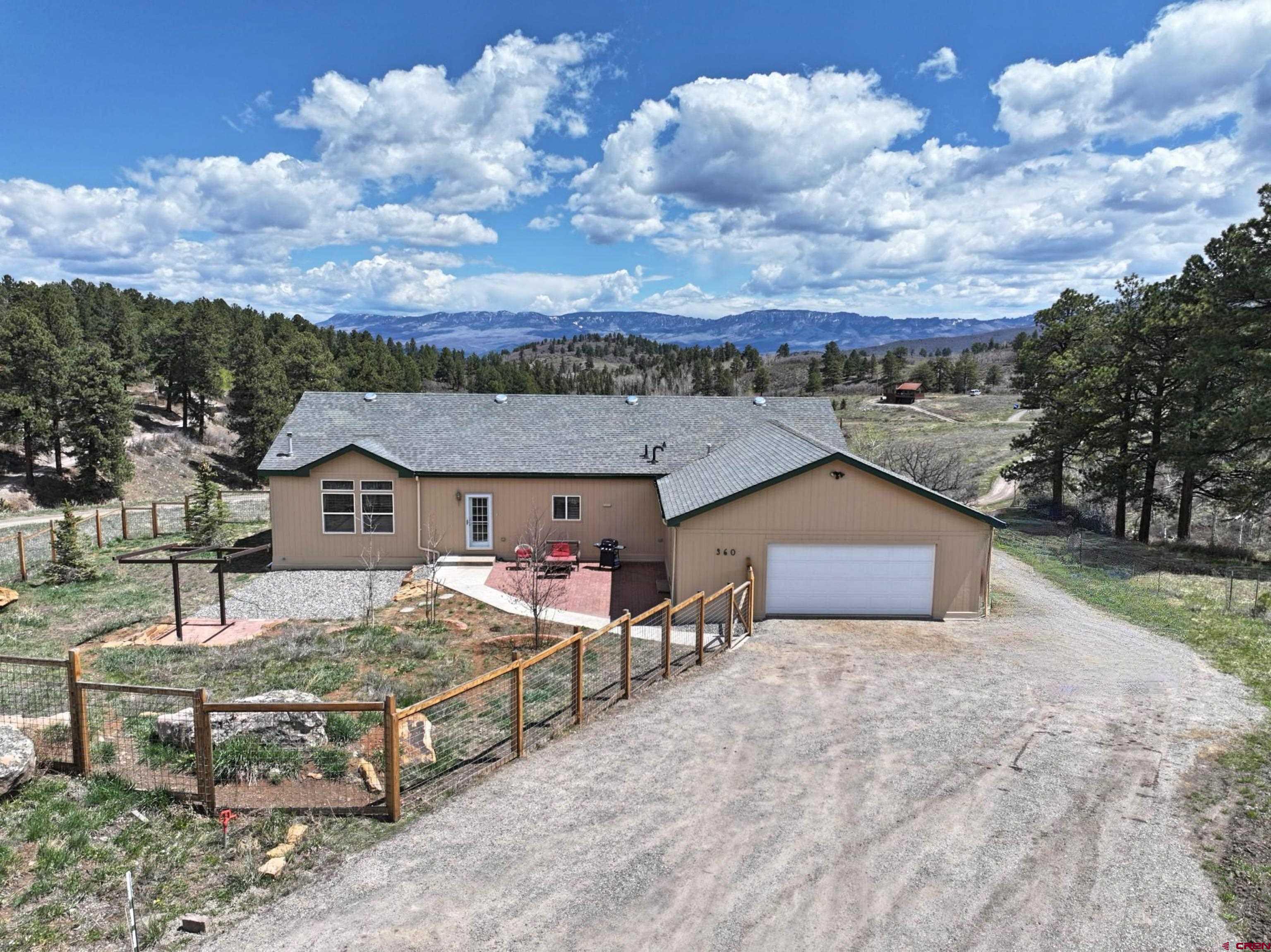 Peaceful Living in Elk Meadows – 1 Acre with Mountain Views Nestled in the tranquil Elk Meadows neighborhood of Ridgway, this well-maintained immaculate manufactured home sits on a spacious 1-acre lot, surrounded by open green space. Set up on a permanent foundation.  Ranch style home with all rooms on the main level and has a split floor plan.  3 bedrooms/2 full baths and a large flex room.  This room could be used as a bedroom but there is no closet.  It could be a den, work out room, office, etc.  Enjoy privacy, peace, and sweeping mountain views right from your doorstep. Inside, you'll find a comfortable, thoughtfully cared-for home—ideal as a full-time residence or mountain getaway. With abundant open space around you, there's room to roam, relax, and take in the natural beauty of the Western Slope. A rare opportunity to own in a serene setting with a strong sense of community and nature all around.  You will encounter a variety of wildlife that adorn the property at any given time.  This is true mountain living with elbow room.