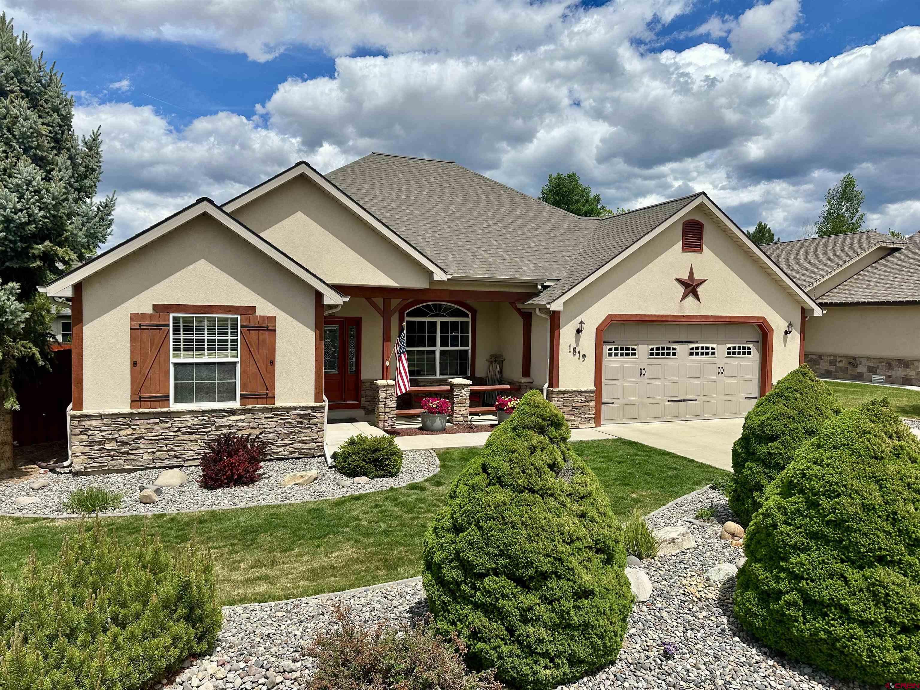 Discover this inviting 1,724 sq. ft. home featuring 3 bedrooms and 2 full bathrooms. Inside, enjoy beautiful hickory hardwood floors, hickory kitchen cabinets, a corner fireplace in the living room which has a vaulted ceiling, and French doors leading to a versatile office or guest room.   The well-designed kitchen has a bar top and the kitchen connects to the dining area, perfect for entertaining. The primary suite has a soaker tub, tile shower and jack and jill sinks. Step outside to a backyard oasis with a covered patio, mature landscaping, and a storage shed. Additional highlights include RV parking with full hookups (electric, water, cable, and dump station) and a garage equipped with a lift to help get your storage items above the garage.This home offers comfort, convenience, and unique features that make it truly special.