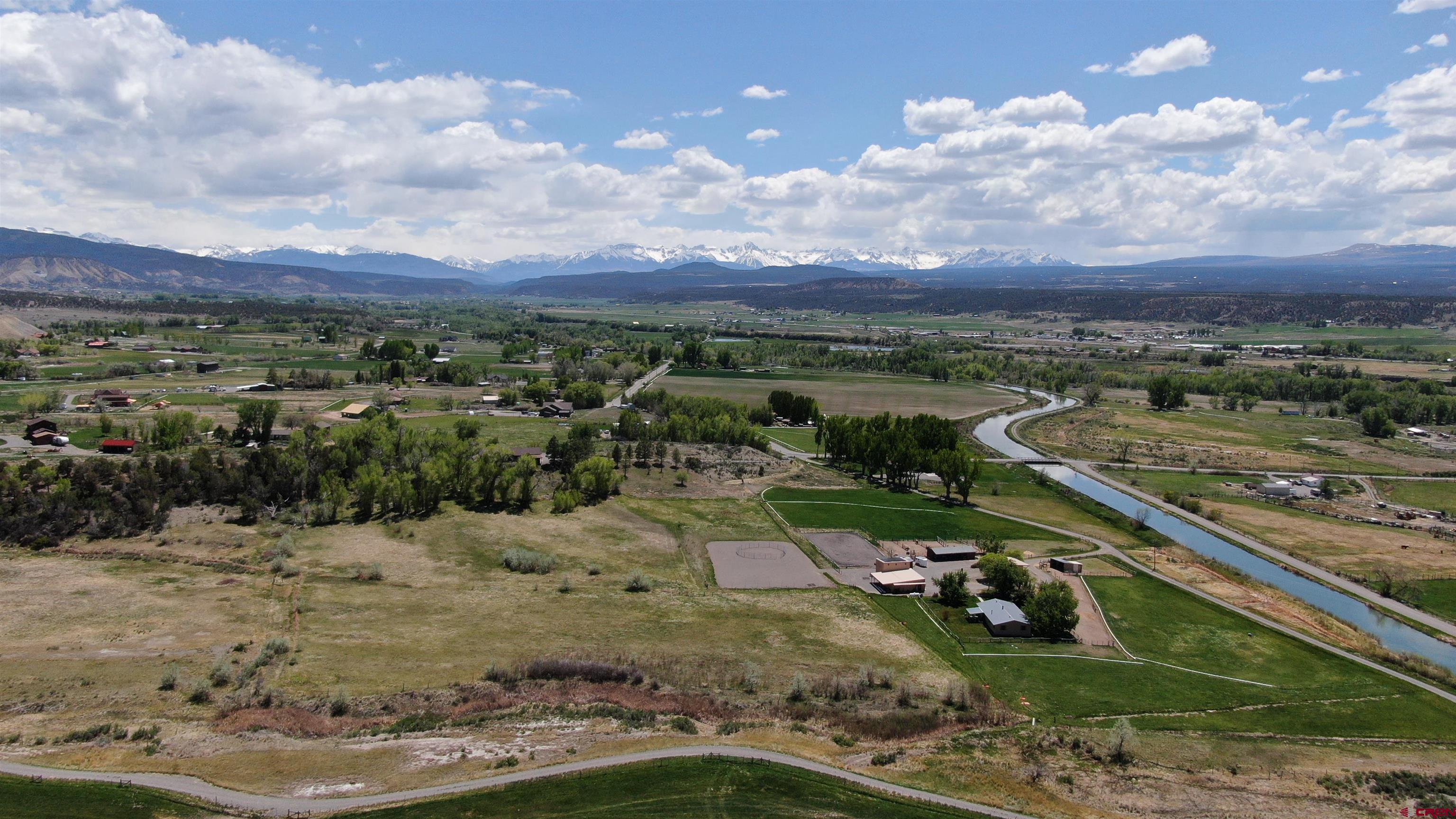 Beautiful Colorado horse farm. Panoramic views from all locations on this 7.88 parcel. Quaint and cozy 1800 sq ft home 3 bedroom 1 bath with an office. The whole farm is totally operated from solar panels but DMEA is available. Large covered patio overlooks a lush fenced in yard with 5 apple trees and a pear tree which function as mature shade trees.  Numerous bushes include a lilac, forsythia, dogwood, honeysuckle and Austrian copper rose bush. The out buildings include an oversized two car garage with 2 additional storage areas, a custom hay barn, a 3 bay equipment shed, a large shavings storage area and a riding arena. There is a 3 stall horse barn with large paddocks that includes a 12x12 insulated tack room and a 12x12 feed storage room. In addition there are 2 large dry lots, one with a 2 stall shelter and 2 other paddocks with shelters. There are 2 1/2 acres of grass hay, which has never been sprayed with chemicals, that produces over 200 bales annually and approximately another 2 1/2 acres  of irrigated pasture.  The property is not on a main road, has a private driveway and is surrounded by 107 acres with only two residences. There is an adjacent 5 acre lot with one share of water on the east property line is available to purchase with this property for an additional $125,000.