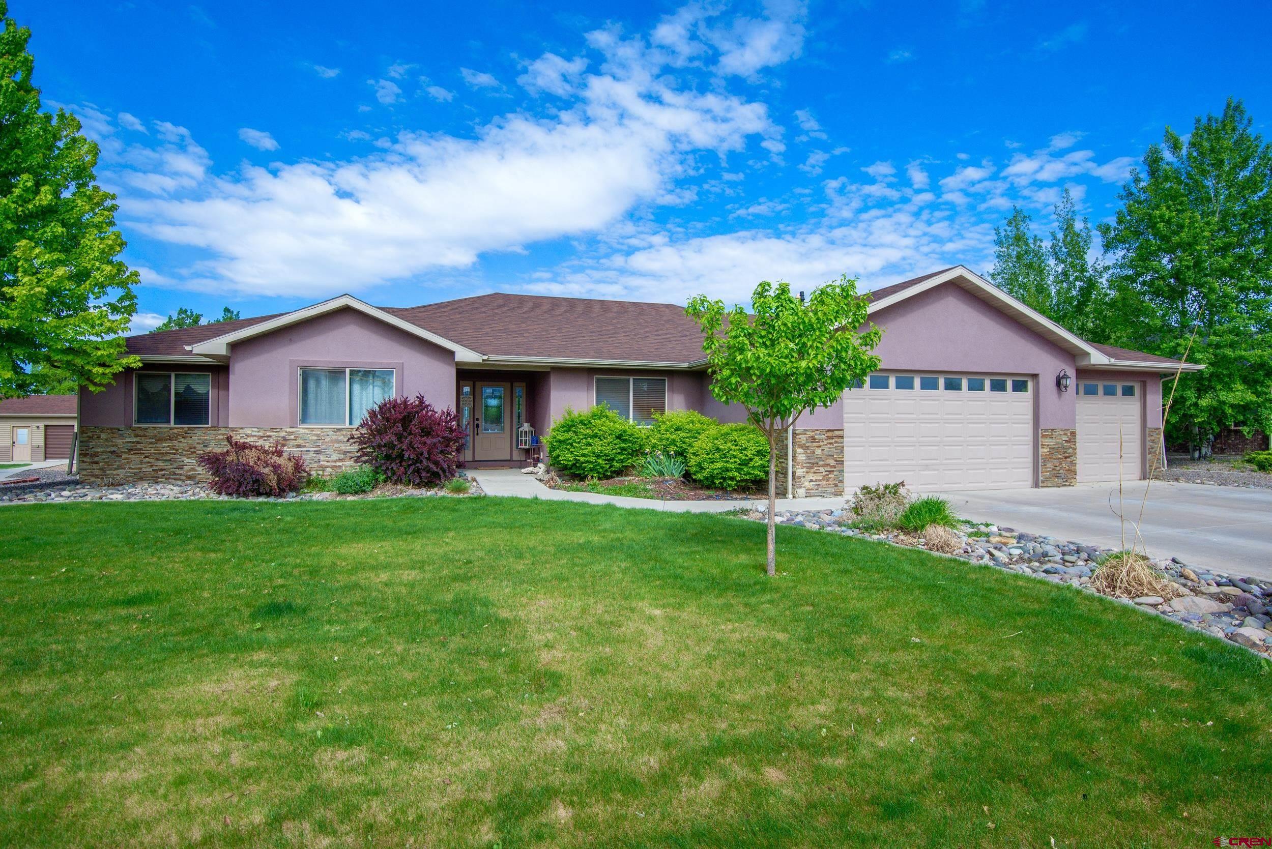 Stunning Custom 4-Bedroom Home with Mountain Views, Hot Tub, and RV Parking.  Don’t miss this beautifully designed 4-bedroom, 2-bath home with a spacious 4-car garage (one double deep) and incredible views of the San Juan Mountains. This custom-built home offers comfort, functionality, and luxury in one of the area’s most sought after desirable settings.  Step inside to discover a bright, open layout featuring a formal dining room, a cozy breakfast nook and breakfast bar—ideal for family meals or entertaining guests. The kitchen is fully updated with granite countertops and brand-new stainless steel appliances, including a stove, microwave, refrigerator and dishwasher. The trash compactor is an added bonus.  The inviting living room features a pellet stove that connects to the home’s duct system, providing energy-efficient warmth throughout the winter. The large primary suite includes a private en-suite bathroom with in-floor heating and a double vanity for added comfort and convenience.  Step out the back door to your personal retreat: a covered patio that leads to a private hot tub and a spacious open-stone paver patio—perfect for outdoor entertaining. The beautifully landscaped backyard is bordered with low-maintenance gravel and offers panoramic views of the San Juan Mountains.  Additional features include:     •    4-car attached garage     •    Designated RV parking with hookups     •    Covered patio + entertainment space     •    Private hot tub     •    Formal and casual dining areas  Located in a peaceful sought after neighborhood with easy access to local amenities, this move-in-ready home is the complete package. Schedule your private tour today!