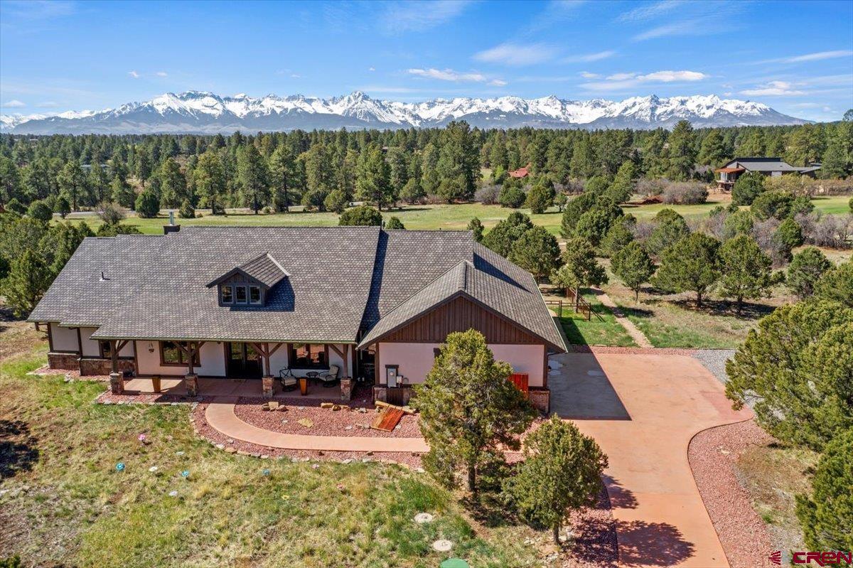 This is your Dream Mountain Retreat . Discover the perfect blend of luxury and nature at 219 Cottontail Lane in Ridgway, Colorado – a stunning custom mountain home for sale with panoramic views of the San Juan Mountains. Nestled in the Divide Ranch and Club Golf Course Community, this immaculate property offers a rare opportunity to own a piece of Colorado paradise with privacy, wildlife, and endless outdoor adventure just steps from your door. The home is situated on just over 2 acres bordering the 14th Green offering privacy and the opportunity to sit back on the covered patio and watch the action from a distance. Sought after single level the home features 3 Bedrooms and 3 bathrooms  + an office/den that could be used as a 4th bedroom. Enter the home to Open-concept living with vaulted ceilings and expansive windows that let the views soak in.  Chef’s kitchen with stainless steel appliances, granite countertops & custom cabinetry. The spacious Primary suite has a walk-in closet and luxury en-suite bath, enjoy the San Juan Mountains from your bed while sipping coffee and watching the deer. The split concept with Primary bedroom and Secondary bedrooms separated by main living areas makes it perfect for families or friends.  The laundry room and garage offer ample space and storage for all your toys... jeeps, bikes, paddlebpards, fishing poles, golf clubs and more. Most furnishings are available with the home so you can move right in.  Located in the exclusive Divide Ranch & Club golf community, and Minutes to downtown Ridgway, CO – enjoy local shops, art galleries, and farm-to-table dining.  Telluride Ski resort is a short drive to world-class skiing, festivals, and culture as well as Ouray Co which offers Hot Springs, hiking, ice climbing and endless trails for off roading. There is  Easy access to Montrose Regional Airport for stress free travel whether it is your Primary Home or a Second home .  Come live where you play!