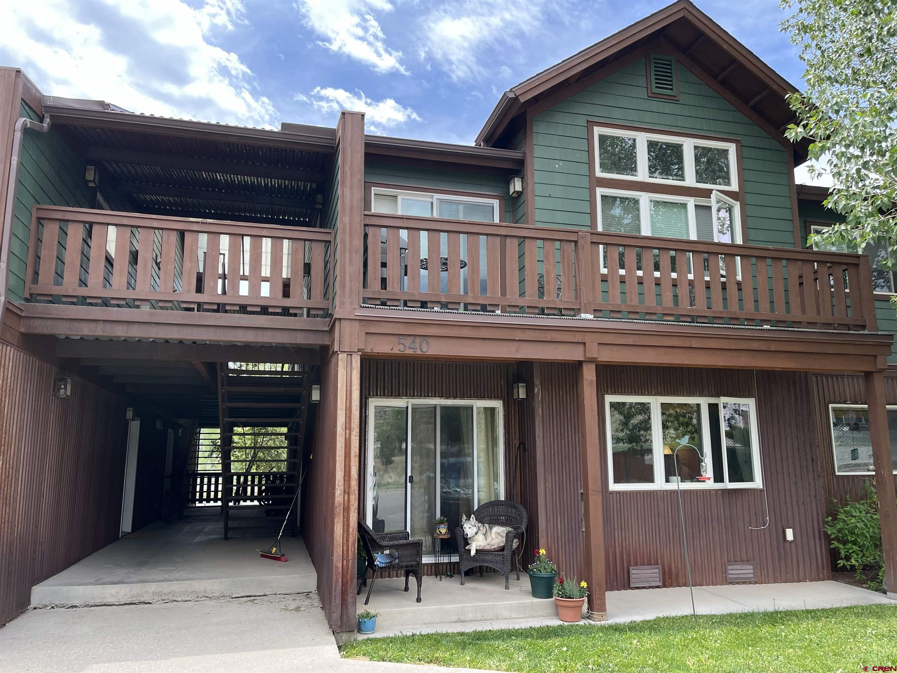 Charming 1 bedroom, 1 bath, lower level Condo in Building E  with detached carport & locked storage.  Clean unit with hardwood flooring and granite counters.  Includes all kitchen appliances plus newer washer and dryer.  Very affordable for first time home buyers or perfect rental property.  Nice covered patio and walking distance to downtown Ridgway.