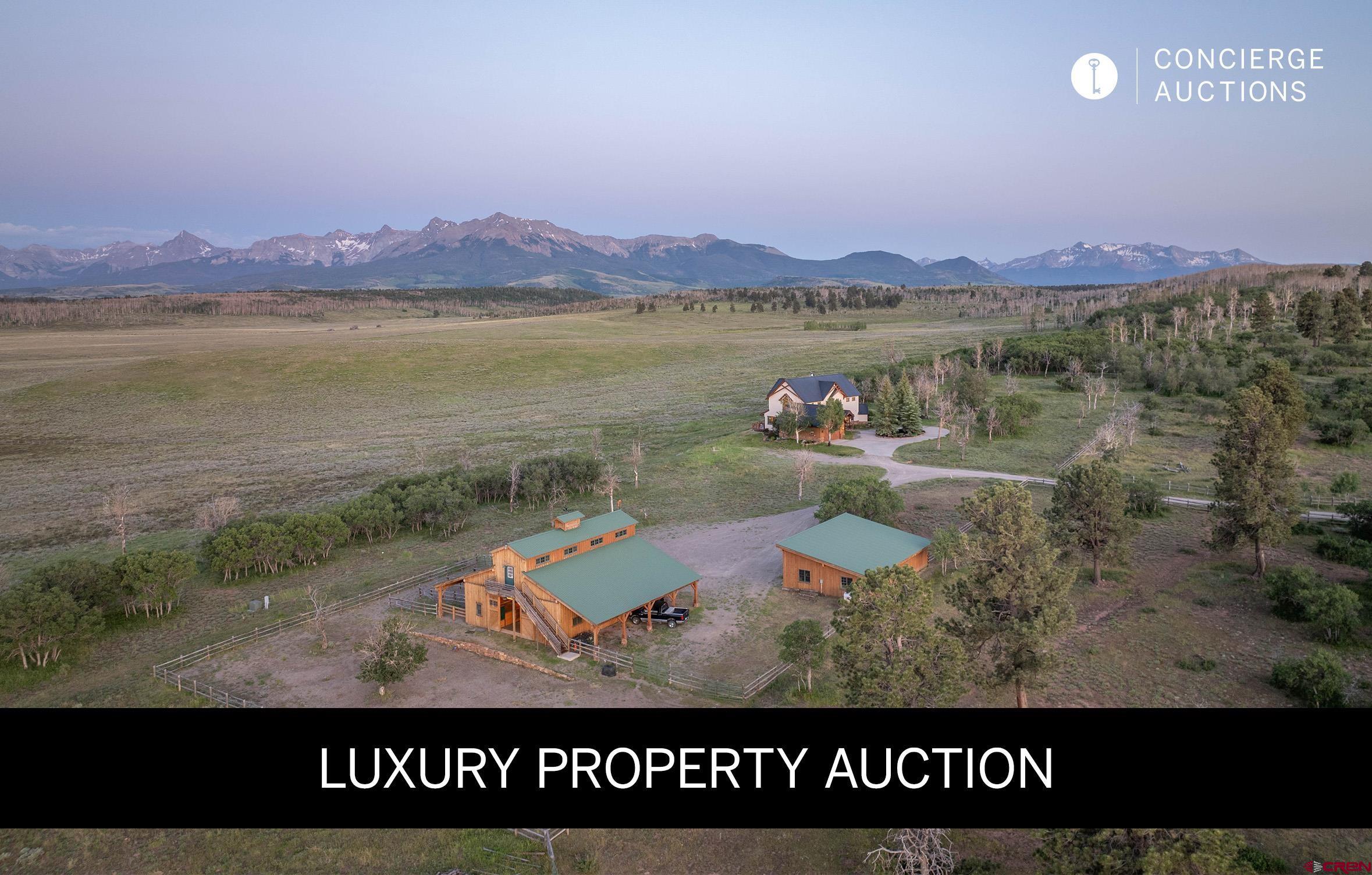 LUXURY PROPERTY AUCTION: 31 OCTOBER–14 NOVEMBER. Accepting Starting Bids Through 30 October. Starting Bids Expected Between $3.5M–$5M.  Earn an incentive by 30 October.  A magnificent legacy estate awaits on this pristine 140+ acre Colorado mountain ranch offering panoramic San Juan Mountain views across thousands of acres of untamed wilderness. This exceptional retreat showcases seasonal wildflower meadows, diverse terrain dotted with sage, scrub oak, aspen, and ponderosa pines, while herds of elk and abundant wildlife roam freely across the property. The custom-designed 3,324-square-foot residence features floor-to-ceiling windows capturing dramatic vistas, complemented by a spectacular 4,279-square-foot craftsman timber frame barn with four-stall horse stable and guest quarters. Located in Colorado's coveted Hunting Unit 61 and centrally located between the ski and golf resort town of Telluride and the historic towns of Ridgway and Ouray , this extraordinary compound delivers unparalleled privacy for the discerning buyer seeking authentic mountain living with world-class recreational opportunities at the doorstep.  Call Concierge Auctions at 646.760.8109 for details.