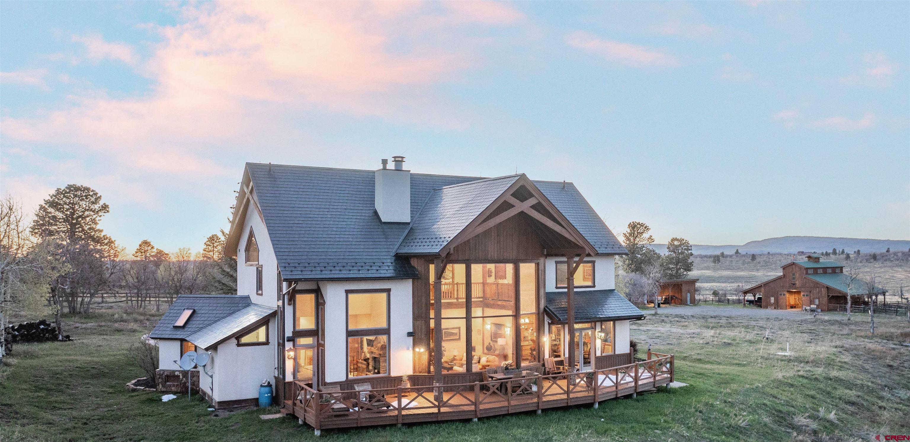 Nestled beneath the Colorado Rocky Mountains, this sprawling 140+ acre ranch with an extensive winding driveway to your private, exclusive retreat will not disappoint. Panoramic views of the Rockies with a visual of thousands of acres to the North, East and South. Boasting wild flowers of all types during spring & summer. Surrounded by Sage, Scrub oak, Aspen & Ponderosa Pine Trees in the fall, it's difficult to choose a favorite season. Herds of Elk and a variety of wildlife casually grazing as they work their way across the meadows; perfect for nature lovers. Snow season is also an excellent time to enjoy the spectacular views from soaring ceilings of endless glass walls throughout the space. Whether taking a break from your everyday life, entertaining family, horseback riding, enjoying the nearby farmers market or catching a breath of fresh air, you'll not be disappointed in the lifestyle this sprawling ranch affords. Its 3300+ square ft house boasts spacious floor to ceiling windows, open floor plan with large living areas and three bedrooms with en suite baths, powder room and two car garage. Step outside to jaw dropping views visible everywhere including A Beautiful Barn Architecturally designed with a Tongue and groove build technique. It's equipped with 4 spacious horse stalls and stall runs and a horse wash stall area. It has a Fully Loaded small tack room and a large horse corral, it has a small living room / office with a pullout sofa bed for occasional Vacay stays. The living space is equipped with a kitchenette and powder bath. The Barn Is a great entertainment space. It can host Event Parties, Weddings etc...  List of Features: * Barn / Horse Stable * Private 4th Guest Bedroom/Office located in Barn  * Back deck extending across the back of the house * San Juan Mountain range views * Custom designed closets with Alder wood * Floor to ceiling fireplace * Large bay window in living area * 2 Car garage * 140 Acres * Built in 2004 * Mud Room * Large Machinery shed * Natural pond, from the snow melt * In floor heating * Septic tank * Well water * Wood floors, casings, and door surrounds navigated from repurpose factory in NC * Natural Slate Back splash in kitchen and throughout home