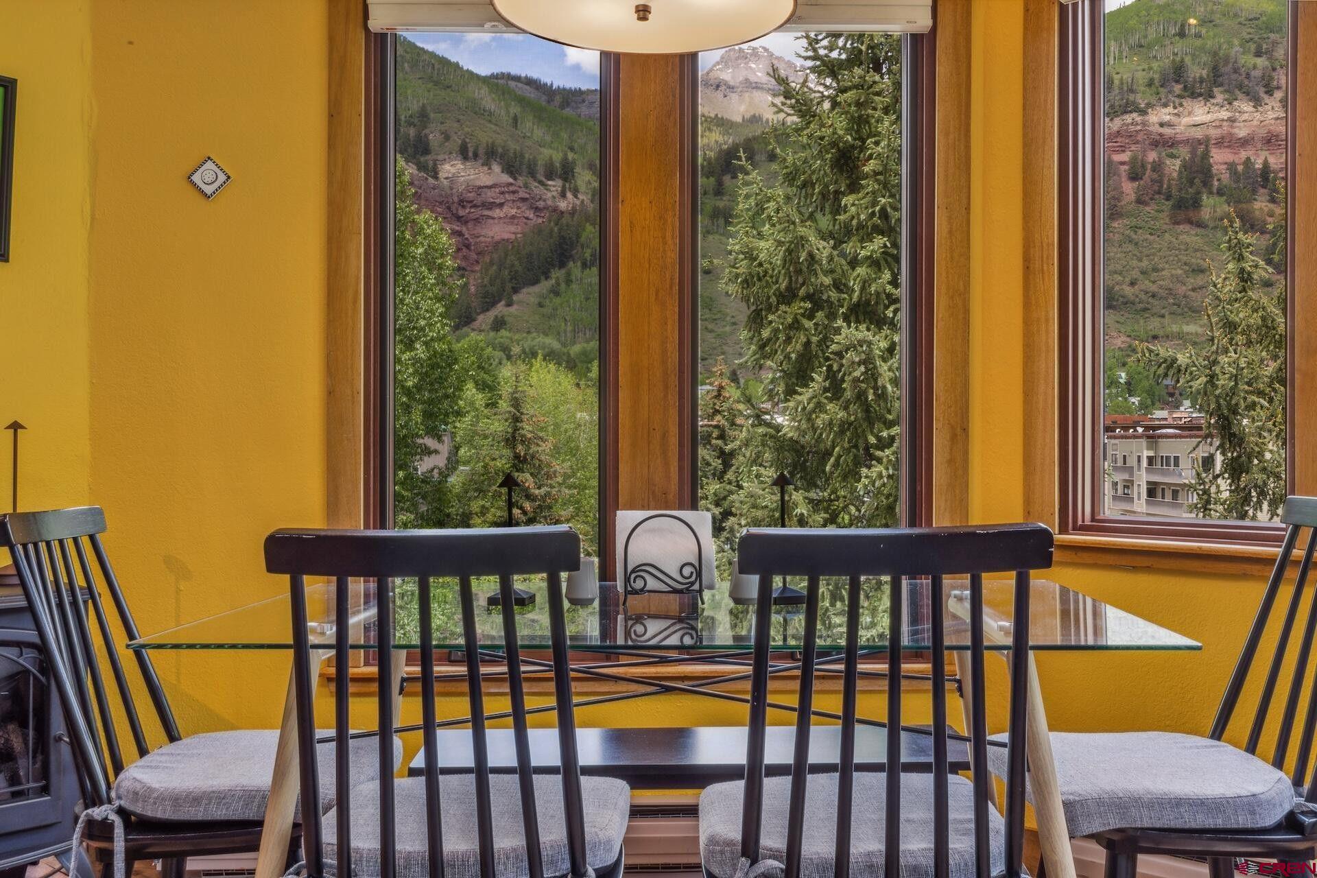 This reimagined two-level, top floor 2-bed, 2-bath Riverhouse is steps from Telluride's thrum and the silver ribbon of river meandering by the residence. Feel the comfortable floors underfoot offering warmth and character. Gaze over town, amid tall, airy ceilings along with the plush of new carpets and a redesigned mudroom. This isn't just located downtown. It offers immediate access to the ski mountain, several high-quality hiking and biking trails winding through stunning scenery, and the pulse of the town's unique shops, buzzing bars and gourmet restaurants. The gondola, lift 8 and the San Miguel River are right there. This location is like having a backstage pass to every event and attraction in town.  This appealing property is a haven for personal enjoyment and presents a compelling investment opportunity. Its prime location and desirable features consistently attract high rental demand, providing a reliable stream of income that can readily offset ownership expenses. Whether seeking a vibrant mountain getaway or a wise investment in a sought-after location, this reimagined Riverhouse offers a solid chance to experience the best of Telluride living.