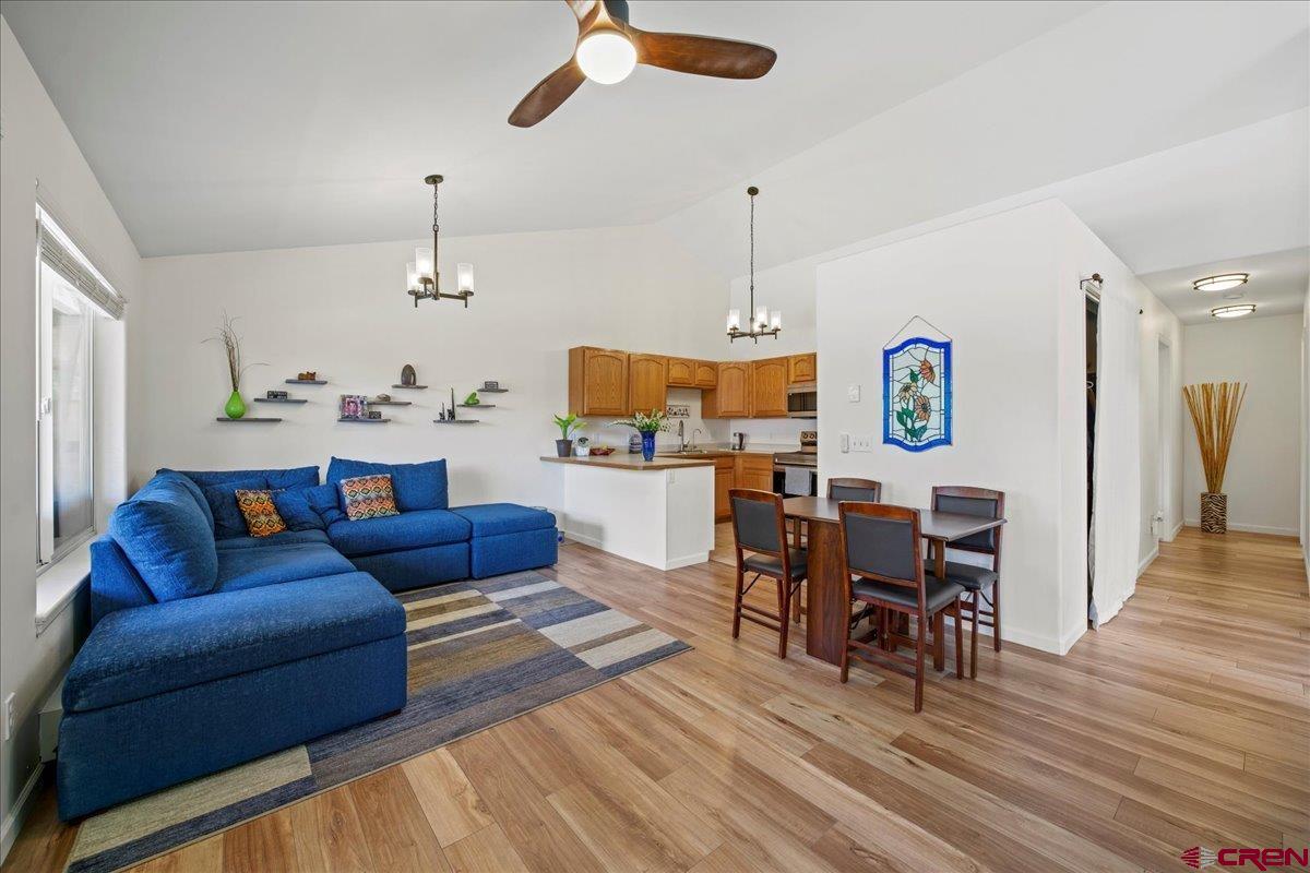 Welcome home to this clean, comfortable, move-in-ready townhouse in beautiful Ouray, Colorado!  This end unit is located in a small subdivision only a quarter of a mile from the main downtown area of Ouray.  It is surrounded by the spectacular red cliffs of Ouray Valley and sets along a river.  The public 2-mile Uncompahgre River Walk Loop is accessible from 2 short walkways from the townhouse.  From inside the townhouse or out on the balcony, you can enjoy the soothing sound of the river which is viewable from one of the upstairs windows.  The main living area, located upstairs, consists of the living and dining area, kitchen, the primary bedroom, a full bathroom, coat closet, laundry room with included stacked washer and dryer, and a north-facing balcony for additional outdoor living.  The entry door and foyer, a full bathroom, 2 bedrooms, and access to the extra-long 1-car garage are downstairs on the ground level.  All 3 bedrooms have nice down-valley mountain views.  Each unit is also assigned an outside parking area in front of the unit. There is no HOA and, hence, no HOA dues!  Enjoy the best in Ouray living, from hot springs to shops and restaurants, Jeeping, hiking, mountain biking, fishing, hunting, skiing, snow shoeing, snowmobiling, birding and wildlife viewing, and much more, from this conveniently located townhouse just outside the hustle and bustle of the historic mining town of Ouray, 15 minutes to the certified creative district of Ridgway, about an hour's drive to Telluride's renowned ski resort, or 45 minutes to the commercial hub of Montrose and its airport.  Come take a look today before this great opportunity passes you by!