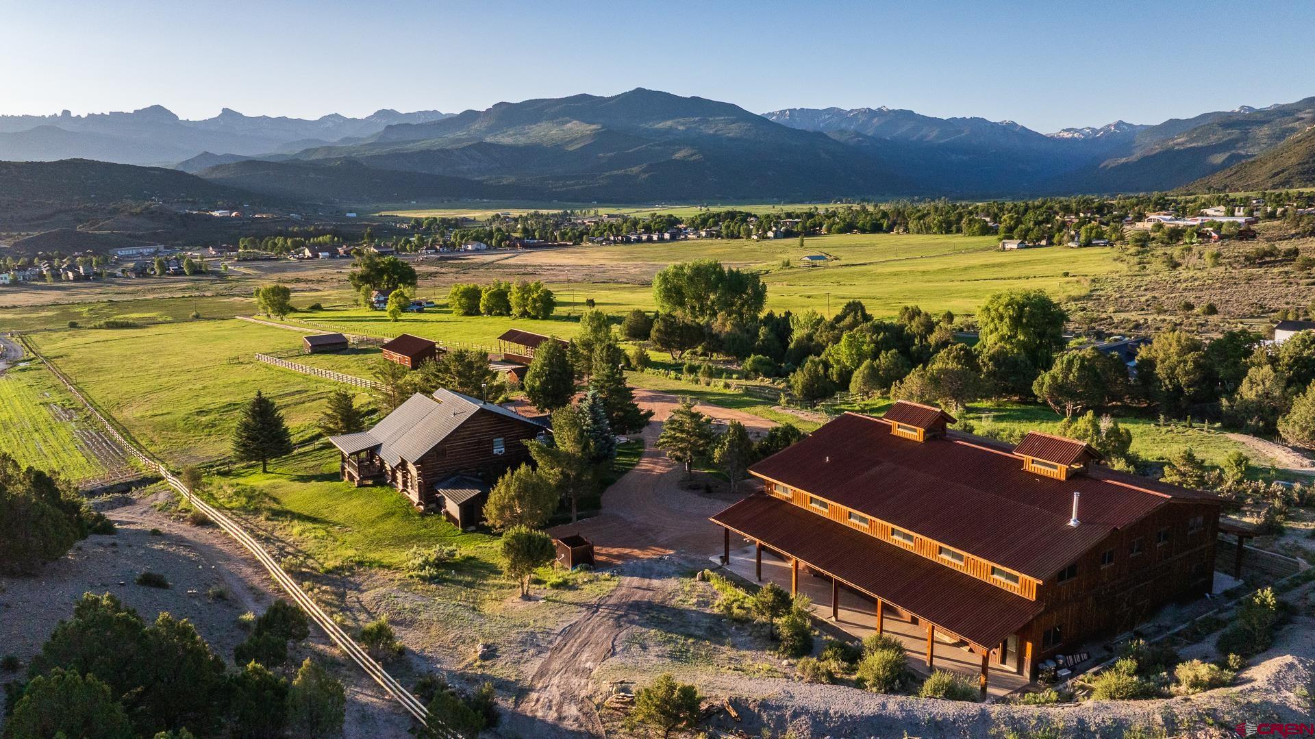 Haven Ranch: Where the Untamed Spirit of the Old West Meets Refined Luxury Nestled amidst the breathtaking grandeur of the Colorado Rockies, Haven Ranch stands as a testament to the harmonious blend of rugged Western charm and unparalleled sophistication. This private family retreat, encompassing over 8 acres of pristine landscape, is ideally situated just five minutes from the vibrant heart of downtown Ridgway. From virtually every vantage point on the property, one is afforded unobstructed panoramic views of the magnificent Uncompahgre Range, dominated by the majestic presence of Mt. Sneffels. To the east, the dramatic sawtooth peaks of the Cimarron Mountains pierce the sky, a cinematic backdrop famously featured in a classic John Wayne Western, adding a layer of storied history.