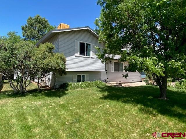 What a Fantastic Opportunity for the Larger Family. 4 Bedrooms and 2 Baths with a beautiful fenced back yard with automatic sprinklers in both front and back yards.  Lots of flowers, bushes and trees plus a nice entertainment area near the firepit. The kitchen is well laid out and is open to the living room along with separate dining. There is splashes of granite and tile and temperature control is assisted by 2 mini split units. You can breath easy in this home because radon mitigation has already been implemented along with numerous other upgrades. This home is located just minutes from central Cortez and Park de Vida lending the ability to ride your bike to work if you work in town or at Southwest Memorial Hospital located just down the street. Great access to schools and the parks and pools. This is a must see for the active family that needs a little elbow room.     When Opportunity Knocks... Take Advantage.