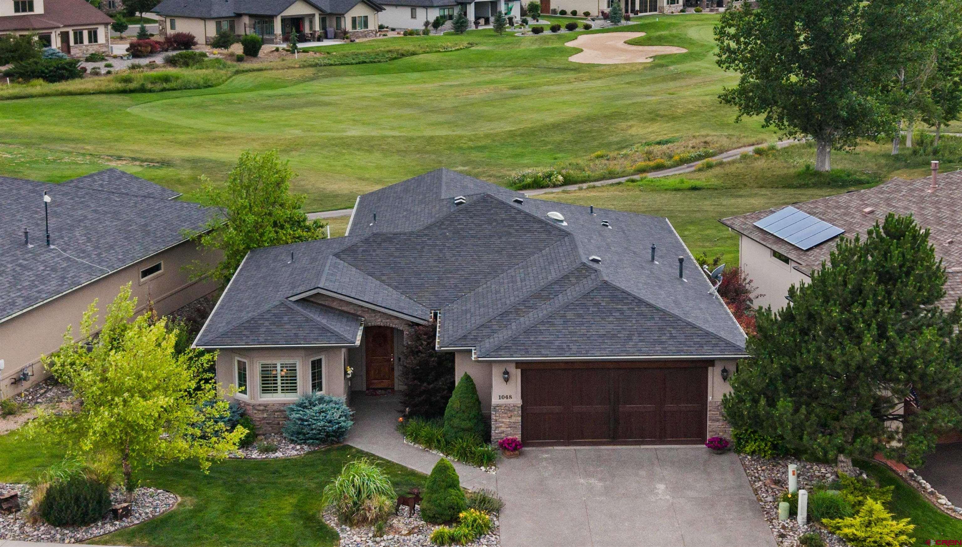 Pristine and Stunning Patio Home with Gorgeous Golf Course Views and High End Finishes, Complete with The Lifestyle of Your Dreams! Excellently placed within the desirable neighborhood of Cobble Creek, this home delivers everything you're looking for and more. Colorado-inspired stone and stucco is accented with a beautiful alpine landscaping package. Step inside to elevated finishes throughout, a versatile floor plan, high-end craftsmanship and the evidence of a high attention to detail throughout. The kitchen features on-trend, modern wood cabinetry, an abundance of storage and counter space, an ergonomic layout, and a great design to host and entertain. A fantastic selling point of this home is that it provides the main en-suite, and an additional 'lock off' suite which is the perfect haven for giving your loved ones privacy and comfort when they visit. Both en-suites are appointed with quality tiled floors and superb walk-in showers. The main en-suite delivers a huge walk-in closet, an oversized soak tub, and serene views of the golf course and beyond. The garage provides a built-in humidifier in the furnace, extra shelving, epoxy floors, and an extended bay, ideal for a golf cart or just extra room to tinker. This home capitalizes on and epitomizes indoor-outdoor living to a tee. A custom-designed and massive back patio is the ultimate oasis for supreme relaxation; your favorite beverage will hit differently as you survey lush golf course landscapes and stunning southwest views. Enjoy a low-maintenance lifestyle with exterior maintenance handled for you, allowing you more time and energy to enjoy all the incredible amenities in Cobble Creek, Montrose, and the Western Slope in general. Experience quick access to healthcare/restaurants, and shopping, and the joy of a blooming community of wonderful, inclusive personalities which have made Cobble Creek the place to be for decades. A short walk to the clubhouse provides a full-service bar and restaurant, as well as a lavish spa, yoga studio, gym, pro shop, and golf simulator. Mile upon mile of bike trail and single track with beautiful vistas are directly adjoined to the neighborhood, enabling you to be healthy and love the outdoors without the crowds, headaches, and drama. Live the good life in Montrose with unmatched weather and seasonal beauty, which also provides consistent, year-round golf opportunities. Embrace a Convenient, Yet Elevated Lifestyle in This Masterpiece Home on a Golf Course Surrounded by the Rocky Mountains; Experience it For Yourself Today!