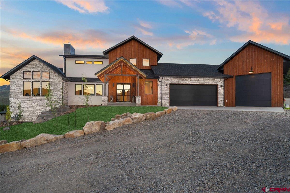 Welcome to this stunning, essentially brand-new home nestled in the heart of Ridgway, Colorado. Built in 2024, this immaculate 5,146 sq ft residence perfectly blends mountain-modern design with thoughtful functionality. Perched to capture breathtaking views of the Cimarron Range and stretching down the valley toward Ouray, every window frames a postcard-worthy panorama.  Inside, you’ll find 3 spacious bedrooms, 5 bathrooms, plus a beautifully appointed mother-in-law suite, complete with its own full kitchen, laundry and living area. The open-concept main living area features high-end finishes and generous natural light. Step outside to an oversized patio designed for entertaining and relaxation, where you’ll enjoy expansive views in every direction.  The finished walkout basement offers incredible versatility, with ample space for a home office, game or media room, gym, studio—or all of the above.   Ideally situated within walking distance to all of Ridgway’s shops, restaurants, parks, and trails, this home provides effortless access to everything this vibrant mountain town has to offer—while still delivering the privacy and tranquility of a retreat. Just 45 minutes to Telluride and 15 minutes to Ouray, this home is truly a rare find.