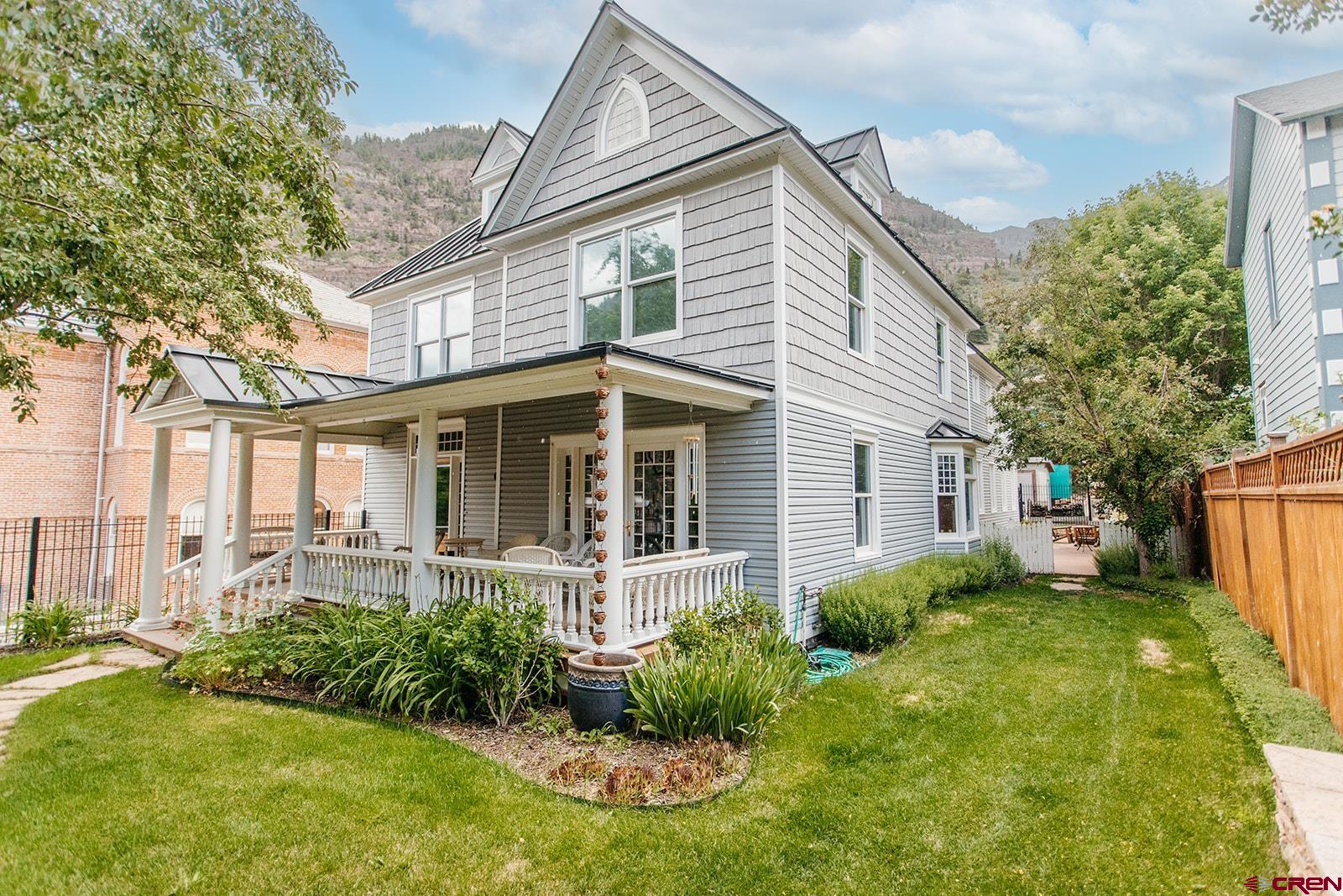 An exceptional home in the heart of Ouray, also known as the “Switzerland of America”. Ouray is famous for its stunning mountain views, outdoor recreation and vibrant community. This property is one block from downtown Ouray where you can enjoy local shops, restaurants and art galleries. This rare gem has character with thoughtful modern upgrades to create a warm, welcoming and highly functional living space. The open floor plan is designed for comfortable living, allowing for easy flow between the living, dining and kitchen areas. The stylish and durable granite countertops in the kitchen add both beauty and practicality. Enjoy comfortable airflow with ceiling fans in every bedroom, living room and foyer. Natural light pours in through the skylight, creating a bright and airy feel in the top bedroom. Cozy up to either the wood burning or electric fireplaces. The decorative leaded glass windows along the stairwell add timeless elegance and charm. There is ample storage for all your mountain living essentials. The heated garage is ideal for year-round use. The high-quality hail resistant roof, metal fencing and durable siding were recently installed making this home very low maintenance. Relax and enjoy the fresh mountain air from multiple outdoor spaces.  Easy lawn and garden maintenance with an automated sprinkler system. This home is move in ready with upscale finishes in one of the most scenic towns of the Rockies!