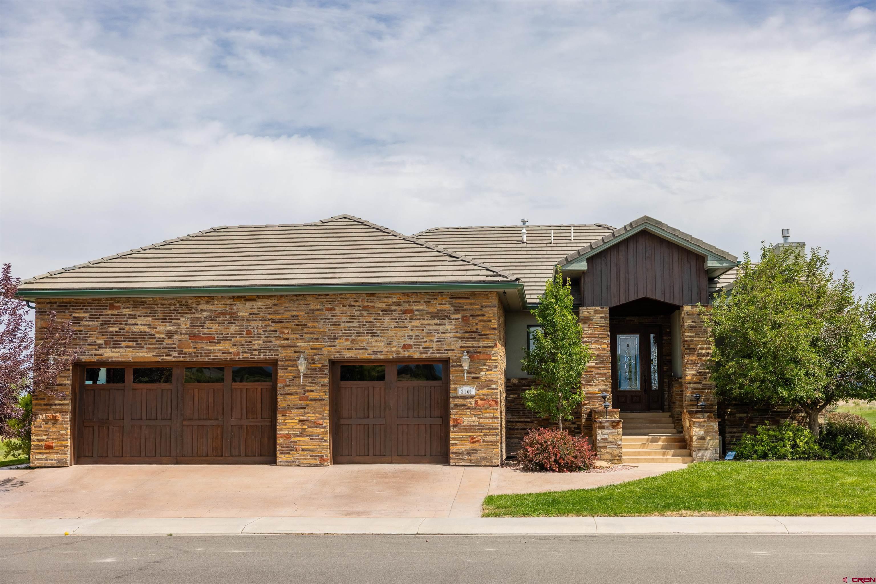 Spacious Custom Home on The Bridges Golf Course with Breathtaking Views Welcome to your dream home in the highly sought-after Bridges Subdivision — where luxury living meets Colorado's natural beauty. Perfectly positioned on a quiet cul-de-sac, this stunning 4-bedroom, 4-bath home offers 3,423 square feet of thoughtfully designed living space with sweeping views of the Grand Mesa and Black Canyon National Park. Whether you're hosting guests or accommodating multi-generational living, the flexible layout offers two bedrooms on the main level and two more on the lower level, making it ideal for a variety of lifestyles. Two primary suites! The outdoor living spaces are  delightful. Enjoy a beautifully stamped multi-level concrete patio or the full-length deck that spans the back of the home, offering the ultimate space for stylish BBQs, sunset watching, or simply soaking in the expansive golf course and mountain views. Set right on the award-winning Jack Nicklaus-designed course, residents here enjoy access to world-class amenities, including the renowned Remington’s Restaurant, known for its spectacular views of the San Juans. Love the outdoors? You're just minutes from the Montrose Recreation Center, local restaurants and coffee shops, and endless opportunities for skiing, hiking, and biking. This location offers the best of both convenience and adventure. Don’t miss this rare opportunity to own a one-of-a-kind home in one of Montrose’s premier communities.