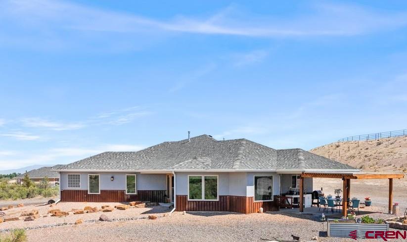A Rare Find for Serene Country Living in Southeast Montrose  Welcome to a lifestyle of ease, comfort, and quiet beauty in one of Montrose’s most sought-after and rarely available neighborhoods. This charming 2-bedroom, 2-bathroom home on 3.2 acres offers the perfect balance of privacy and convenience—ideal for those ready to slow down and savor the best of Colorado living.  From the moment you arrive, you’ll feel the tranquility of this special property. Nestled in a peaceful, established community with lovely views of the Cimarron Mountains, this home is designed for low-maintenance living and high enjoyment. With polished concrete floors throughout and a well-appointed kitchen featuring granite countertops, everything is built to last—and built to be enjoyed.  The attached 2-car garage offers everyday convenience, while the custom-built, heated metal garage (24' x 43' x 15') with a 14' roll-up door is a dream for those with a love for RV travel, hobbies, or storing outdoor gear. Whether you're hitting the road for adventure or staying home to work on personal projects, this space offers room to grow.  Enjoy morning coffee or an evening glass of wine on the patio while watching deer wander through and the sky light up with sunset colors. The backyard is perfectly suited for quiet moments, casual gatherings, or barbecues with friends and family.  Inside, the primary bathroom features a soaking tub—perfect for relaxing after a scenic drive or a day exploring the nearby Black Canyon, Grand Mesa, or the trails of the San Juan Mountains. Montrose also offers excellent healthcare facilities, vibrant shops, and beloved local restaurants, along with fun community amenities like a family-friendly water park.  Whether you're looking to downsize, retire, or simply a quiet home base to return to between travels, this home checks all the boxes: peaceful, practical, and full of possibility.