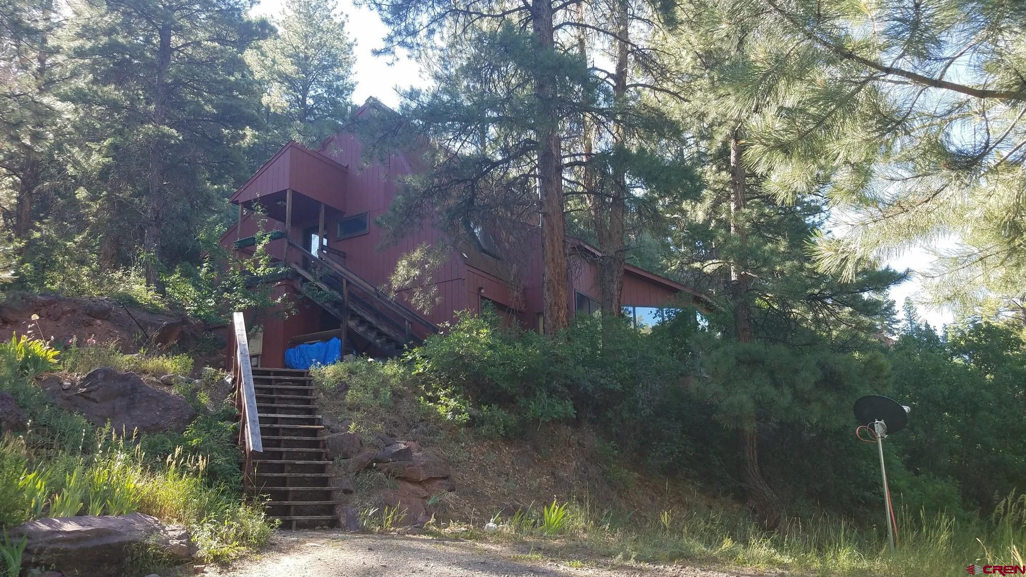 This is an ideal home for someone just starting out or a remodel project. 1581 square foot two level home 2 bedrooms and two total baths includes a small studio accessed from an outside staircase. Large deck on the south side of the home is ideal for evening entertaining. Lot is 1.55 acres with a nice mix of trees. Current owner has been in the property since 1997.