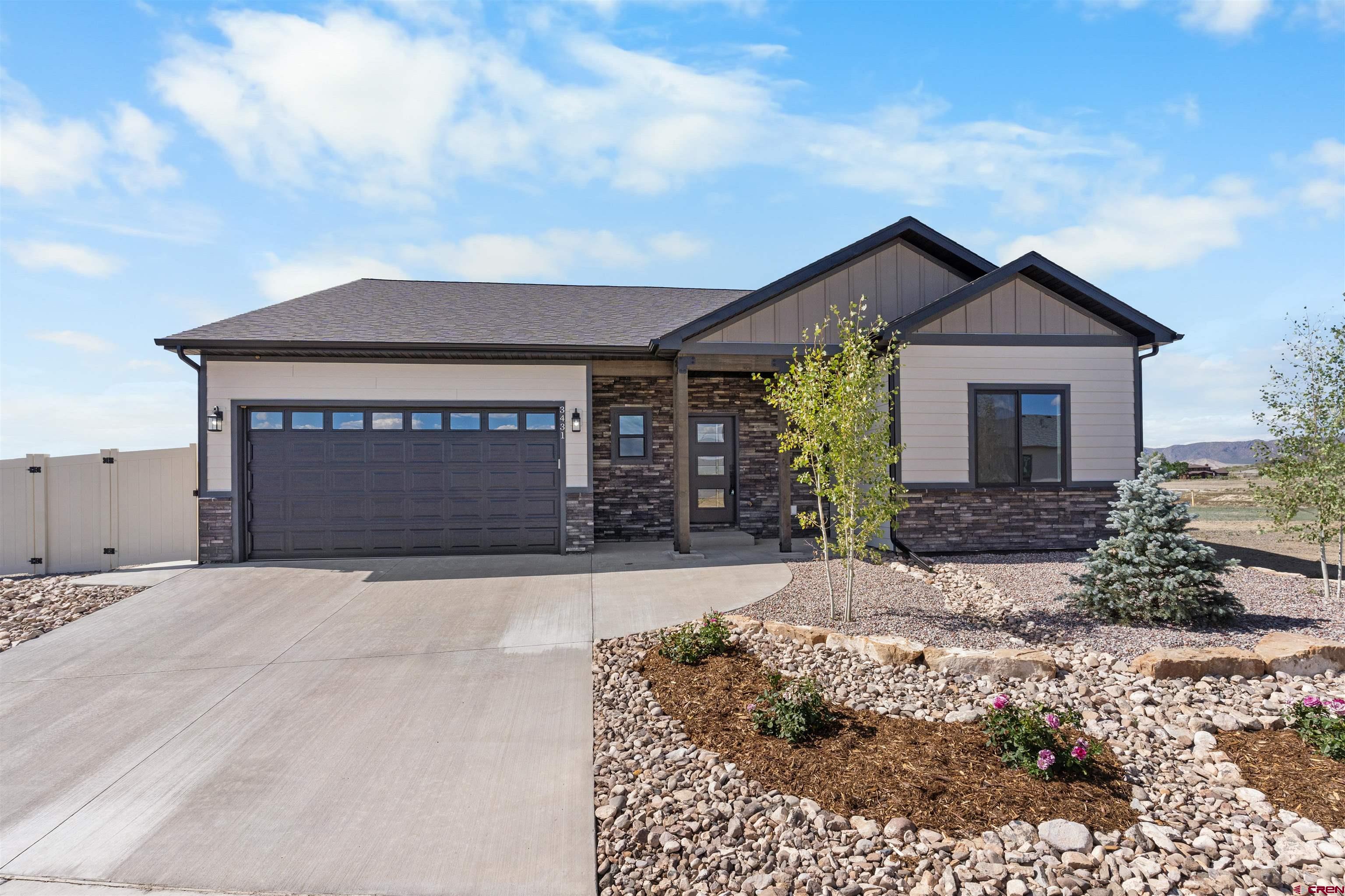 Brand new, beautifully finished, and completely move-in ready — this single-level Grand Teton model offers 1,808 sq ft of thoughtfully designed space with 4 bedrooms, 2 bathrooms, and a bright, open layout perfect for modern living. You'll love the fully landscaped front and backyard, complete with fencing, an extended patio for entertaining, and a double-swinging gate with space to park a small trailer. Step inside to vaulted ceilings, a cozy stone-accented gas fireplace, and a stunning kitchen with soft-close cabinetry, quartz countertops, tiled backsplash, under-cabinet lighting, pendant dimmers, two pantries, and a full stainless steel appliance package including a gas range, microwave, dishwasher, and fridge. The spacious primary suite is a true retreat, featuring a vaulted ceiling, tiled walk-in shower, soaking tub, dual vanity, private toilet room, and generous walk-in closet. This home also offers ample storage throughout with two large coat closets, hallway linen storage, and a laundry room with cabinets, folding counter, washer and dryer. The oversized 2-car garage includes an extended bay—perfect for a home gym, workshop, or additional storage space. Energy-efficient features include central A/C, on-demand hot water, radon system, and forced air gas heat. Located in the beautiful Woods Crossing subdivision with stunning San Juan Mountain Range views and easy access to town, this home offers the perfect blend of peace, convenience, and Colorado beauty.