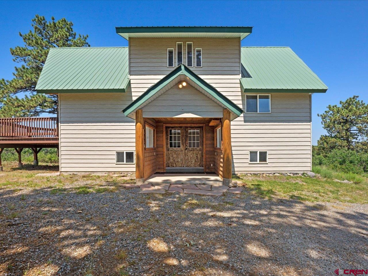 Great year around living or summer home, this 3 bedroom, 3 bath home sits on .93 of an acre in Elk Meadows Subdivision.  The property is nestled among the Aspen and Pine trees with outstanding mountain views.  There is beautiful hardwood flooring, which adds to the mountain flair.  A metal roof and plank siding help reduce exterior maintenance.  The forced air heat and two wood stoves make for a toasty winter. The stove on the main level is also a cook stove. The picturesque land and mountain views enhance the property.  2-Car detached garage is great for winter and has a ton of storage.  The utilities are in place:  power, propane and water.