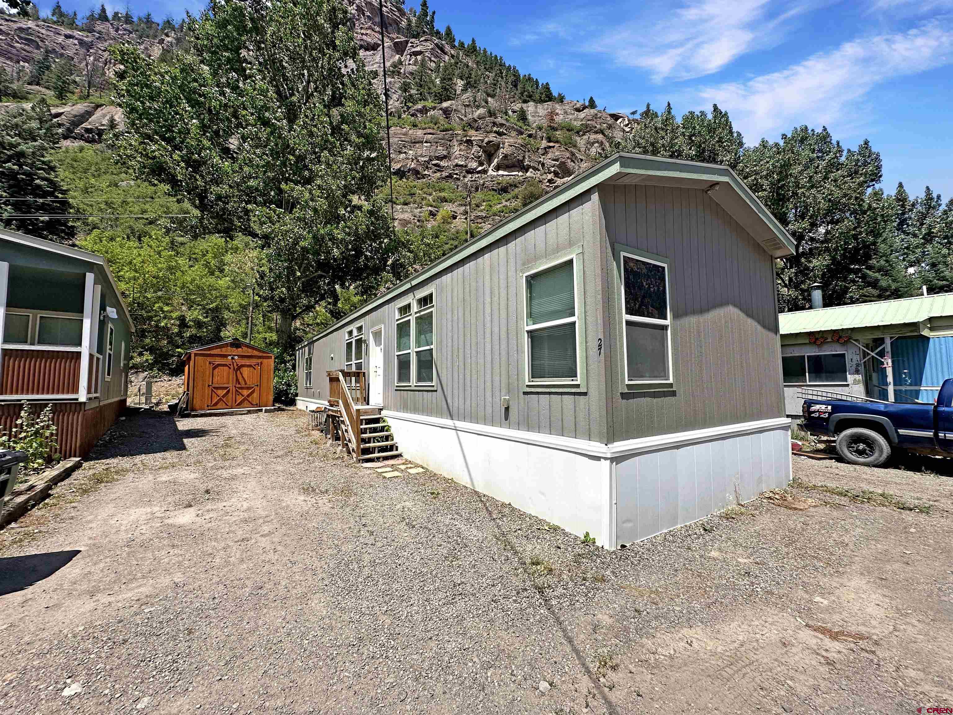Affordable Mountain Living in Ouray. Don’t miss your chance to own a clean, comfortable 2016 built manufactured home with 1,130 square feet of living space in one of Colorado’s most iconic mountain towns. Located in the well kept 4J RV Park community, this 3 bedroom, 2 bath home offers a bright open floor plan, modern finishes, and unbeatable affordability. Lot rent is just $230 per month and the HOA fee of $225 per month includes water, septic, and trash service, making for low maintenance, cost effective living. Whether you're looking for a full time residence or an affordable second home in the mountains, this is one of the best values you’ll find in Ouray. Homes in this price range don’t last. Schedule your private showing today.
