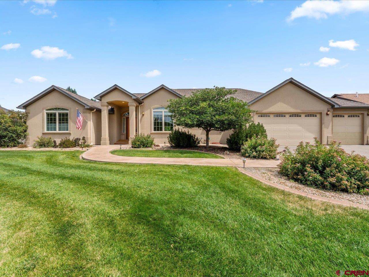 Come fall in love with this beautiful custom ranch style stucco home on over a half-acre with a privacy park-like backyard escape. This beauty features 3 bedrooms and 2.5 baths, a large office, and an open concept kitchen and living room area. There is a large chef's kitchen w/butcher block island, many pullouts, pantry, stainless steel appliances, granite countertops and eat-in countertop.  Great primary bedroom suite with two closets, jetted tub, step in shower and dual vanity sinks. Bathrooms feature travertine tiles and slate. The 10' ceilings and slate/honed floors are inviting along with the gas log stone fireplace. There is a breakfast nook, and formal dining room for all your entertaining needs. There is central air with in-floor gas hot water heating, and an oversized 3-car garage. Step out and unwind in the large covered rear patio while you feel like you have your own private back yard paradise.  The professional landscaping boasts of a cascading water feature, raised garden area, and lush lawn. All with irrigation water, and a good-sized garden shed. Come see it today and make your dream a reality!
