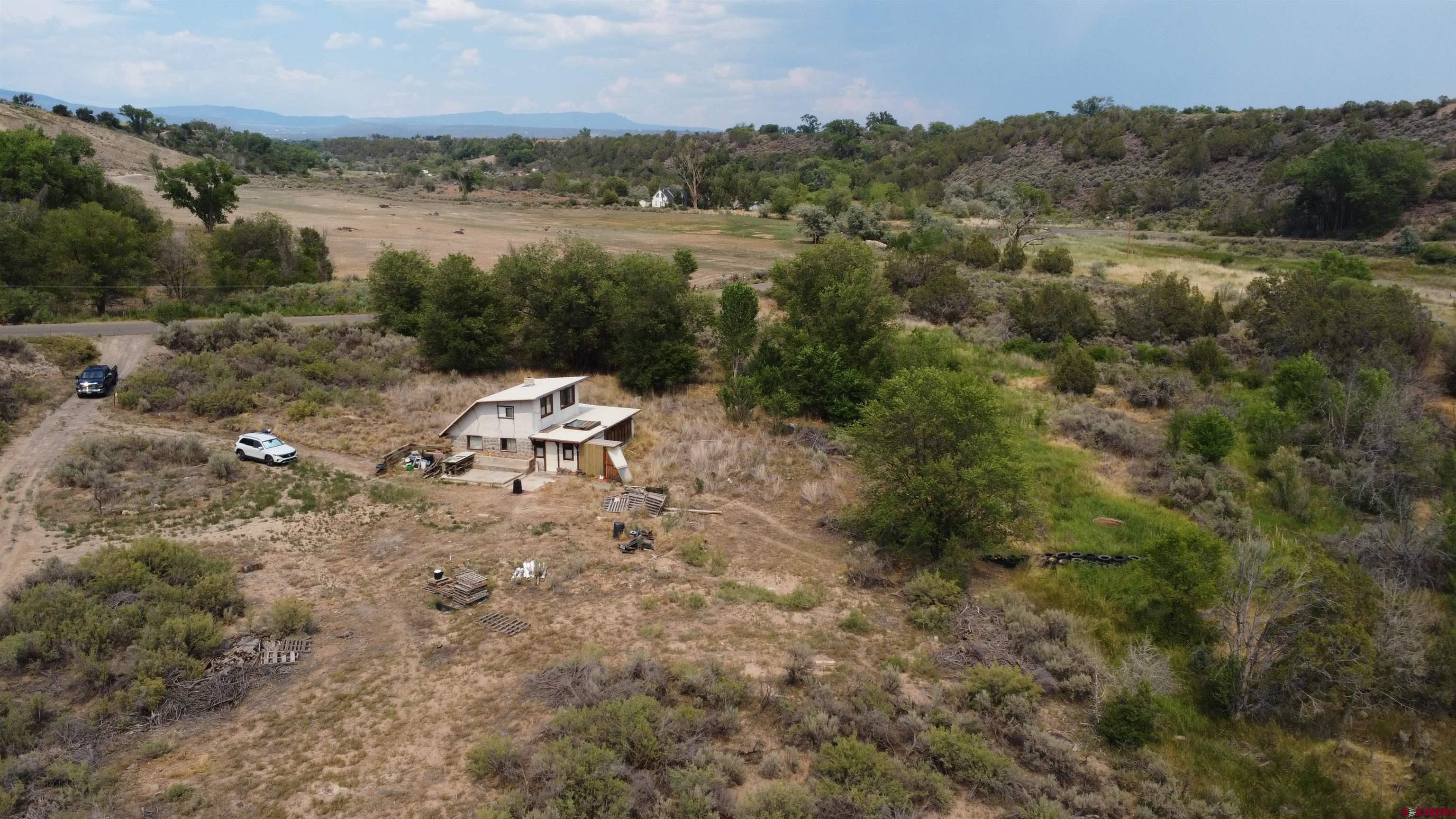 What a wonderful opportunity to own an off grid home on 10.58 acres.  This is your chance to own a property to enjoy peaceful Colorado evenings, tranquil mornings, and open space.  The home has no electricity and no water hooked up to it.  The property does have a permitted, hand dug, well.  Enjoy time down by the "creek" that runs along the property.  This property has room to spread out, room for toys, raise some animals, just let your imagination run wild.