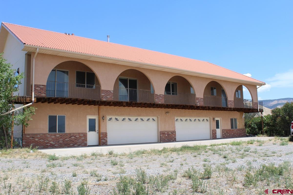 This 3150 Sq. Ft. southwest style home has 3 beds, 2 and 1/2 baths, sets on 5.74 acres and is located in one of the most desirable locations in Montrose, South just off Uncompahgre Road with spectacular San Juan views from the large wrap around deck. The home has beautiful Spanish Style Arches from the main level overlooking the majestic Uncompahgre Valley. All the rooms are extra large and spacious. The roof is very attractive tile. The attached garage is an over-sized 4 car, you could park 8 small cars in just the garage. There is the 45x100 insulated metal shop. The home does need work and TLC. The home is very well built, and the shop is a workman's dream. The location is one of the best in the area south of Montrose. With a little work and TLC this is a million dollar home!