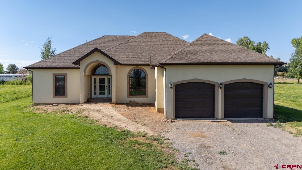 Spectacular custom Florida Mediterranean style home located in Ponds Edge on Spring Creek Mesa.  This charming one-level home features a beautiful setting with split dowl wood fencing, mature pasture and landscaping and irrigation water.  The interior of the home features vaulted ceilings, split floor plan, Hickory cabinets and granite countertops throughout.  Tile floors in the kitchen/dining/laundry and bathrooms, double vanity sinks and walk-in closet.  Additional features include stucco exterior, 2 car garage, covered back patio with stained concrete, irrigation canal on south boundary line.  All on a horse friendly property.