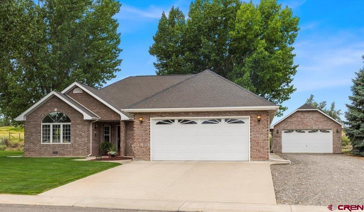 **Charming Home in the Highly Desirable Otter Pond Community**  Welcome to this beautifully maintained 3-bedroom, 2-bathroom home nestled on just under an acre in the sought-after Otter Pond neighborhood. This one-owner residence has never been on the market and was thoughtfully built and lovingly maintained by its original owners.  The home offers a spacious and inviting layout with hardwood floors and carpet throughout. It features two distinct living areas: a formal living and dining room complete with a cozy fireplace, elegant crown molding, and large windows that fill the space with natural light, as well as a comfortable family room—ideal for relaxing with a book or enjoying your favorite shows.  The kitchen seamlessly opens to a sunny breakfast nook, perfect for casual meals or entertaining. A charming bay window overlooks the beautifully landscaped backyard and provides a serene view of the open pasture beyond.  The generously sized primary suite includes a large bathroom and walk-in closet, while the two additional bedrooms—one currently used as a home office—share a well-appointed full bathroom. All rooms are spacious, including a laundry room with ample cabinetry and storage.  Additional features include an attached two-car garage with access from the laundry room, and a separate detached third garage offering plenty of space for a boat, recreational equipment, or an additional vehicle.  This home is perfectly suited for those looking to live in comfort. The Otter Pond community is known for its peaceful setting and friendly atmosphere—truly a wonderful place to call home.
