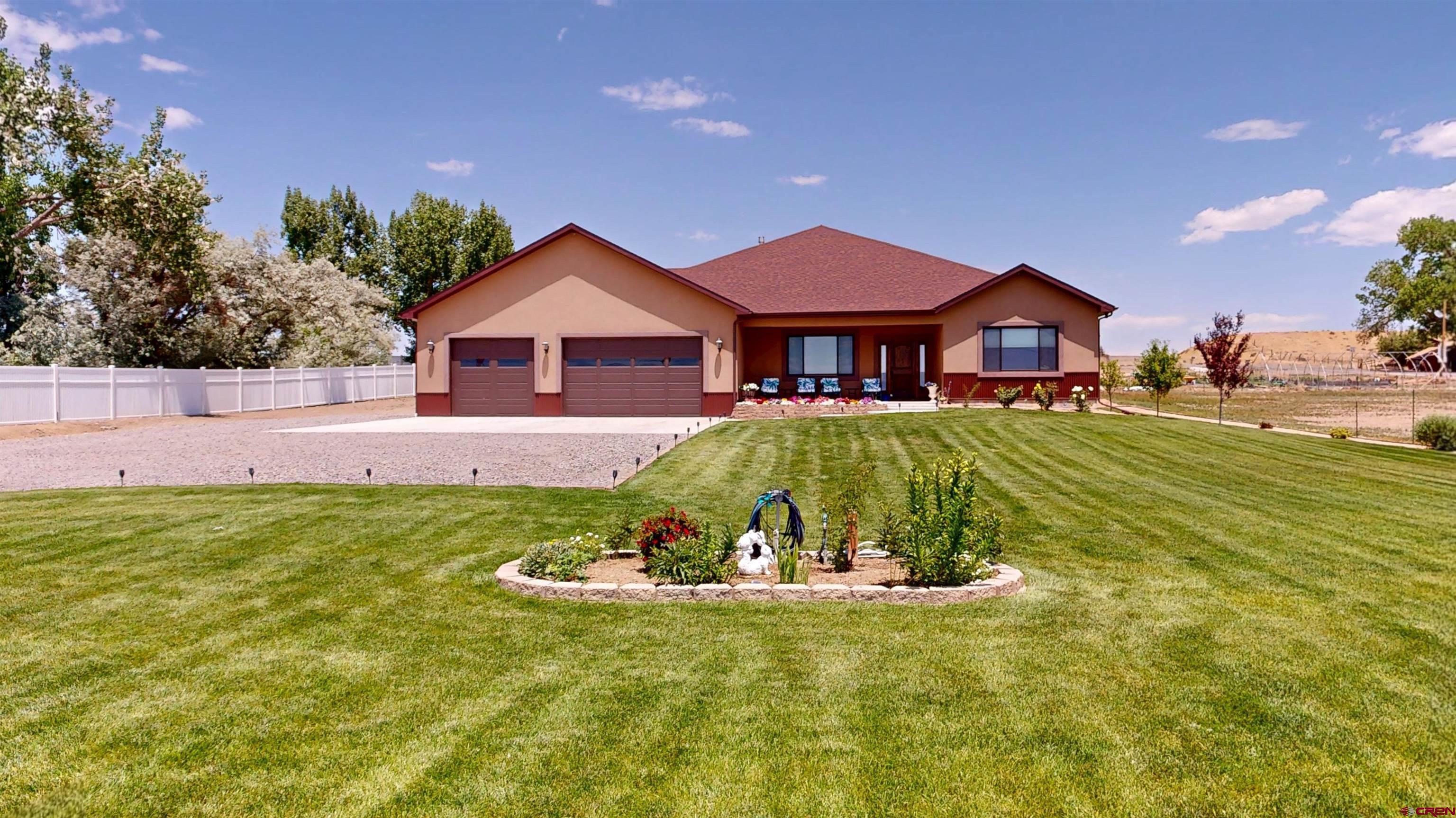 Million-Dollar Mountain Views | Custom Built Luxury Home on 1 Acre - 4 Bed | 2.5 Bath | 2,515 Sq Ft. 1000 Sq Ft 3 Car Garage  From the moment you enter you'll be captivated by refined finishes, thoughtfully designed spaces, and the seamless blend of luxury and functionality that make this home truly special. This spacious 2,515 Sq Ft elegant single level home offers 4 bedrooms, 2.5 bathrooms open concept split floorplan designed for comfort and privacy. The 4th bedroom is currently configured as a spacious home office, ideal for remote work with stunning views.  The open-concept design showcases a grand room with large coffer ceilings. Inside, you’ll find high-end finishes throughout, including granite countertops in every room, knotty alder doors and trim, large gas fireplace. in floor electrical for theater seating, Cat 6 wiring, built in wiring for speakers and security camera system. Enjoy ceiling fans in every living space with central air for year-round living.  Step outside to a large covered back deck with a ceiling fan-perfect for entertaining or relaxing while enjoying peace and quiet. The master suite and dining area open to the back deck via French doors, bringing the outdoors in.  The yard includes 17,000 Sq Ft of lush grass, bushes and trees with a full in-ground sprinkler system and irrigation system. The back yard features a retaining wall and a French drain system. All this beautifully landscaped property comes with .4 shares of UVWUA for easy maintenance.  The massive 1,000 sq ft 3-car garage is plumbed for gas heat, offering the perfect setup for a workshop, hobby space, or car collection.  Ideally located near one of the area’s most desirable grade schools, with convenient access to the highway and just minutes from downtown amenities, yet still offering the peaceful charm of country living.  Blending luxury, modern technology, and the tranquility of country living, this thoughtfully designed home offers comfort and style at every turn. Begin your day on the covered front porch, coffee in hand, as you take in the sweeping, scenic views  BONUS: Save with no HOA and reduced county taxes—3.88% sales tax savings compared to city living!  Summary Views, 2633 Sq Ft with 4 Bedrooms, 2.5 Baths, 3 Car 1000 Sq Ft Garage. Open Concept, Split Floor Plan, 1 irrigated landscaped acre with .4 shares of UVWUA water. Granite countertops, Huge Island, Covered Porches, Recessed Ceilings, mud room/Laundry.