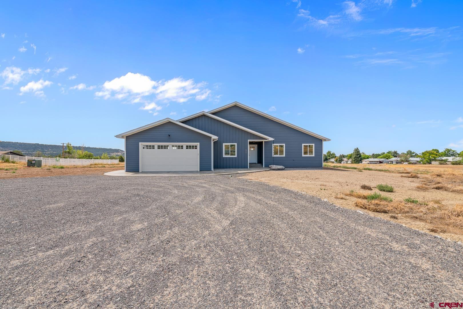 Superior quality, thoughtful design, great location, and outstanding views are all attributes of this brand new home. Just a couple of minutes from downtown Cedaredge this property offers ease of access and outstanding views extending from the Surface Creek valley to the San Juans and back around to the Grand Mesa. Access to national forest is also just minutes from your front door. This 4 bedroom, 2 and 1/2 bath layout flows flawlessly and gives you ample room. 4th bedroom would make a great office. Clean lines and vaulted ceilings with recessed lighting throughout show off the workmanship. Granite kitchen and bathroom countertops with rich wood cabinetry and upgraded stainless steel appliances. Master bath has separate his and her vanities and walk-in closet spaces! Nice size spare bedrooms with walk in closets. Laundry room and 2 car attached garage. Level building spot for a detached shop. Stamped and stained concrete front and back. NO HOA or Covenants. Come see for yourself!