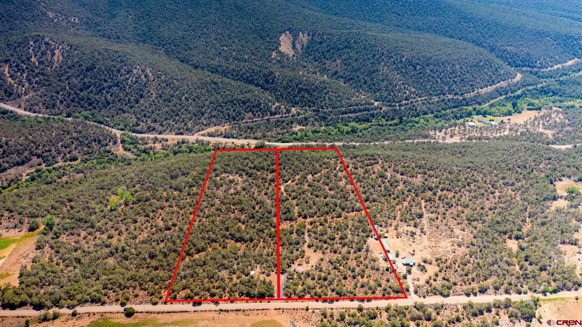 11.59 private, wooded acres on Redlands Mesa that is off the beaten path but still very accessible. Perfect spot for a homesite, recreational cabin, or place to camp on the weekends. There is access to a shared well and an agreement will be put into place before closing. Power is also on the lot. Several good spots to build. Access to national forest is minutes away. Shared access with adjoining parcel. No HOA.