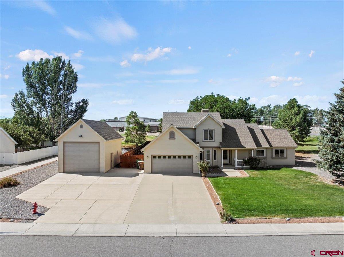 2467 sq ft Custom built home in one if the most desirable communities in Montrose, Otterpond. This well maintained 3 bedroom 2.5 bath home sets on over 1/2 of an acre of beautifully landscaped irrigated property. The home offers a spacious & inviting layout for a large family or entertaining. The kitchen is nicely arranged with lots of hardwood flooring & large spacious rooms. This home could easily be a 5 bedroom, as there is a large office & a 15 x 13 bonus room off the main bedroom. The main bedroom, is on the main level & has a large walk-in closet, jetted tub & spacious bonus room off the bedroom making a great TV/reading room or nursery. There is large covered deck out back with well manicured lawn, large pine trees & privacy fence making the backyard very private. There is lots of cement surrounding the house making for great parking. The man's dream is the 18 x 34 RV garage/workshop to park those extra cars, RV's, travel trailer or recreational toys. The location of this home is as good as it gets. Walking distance to schools, Rec Center, close to shopping, Walmart, Home Depot and many other amenities. Best of all, it's priced to sell! Don't miss this one.