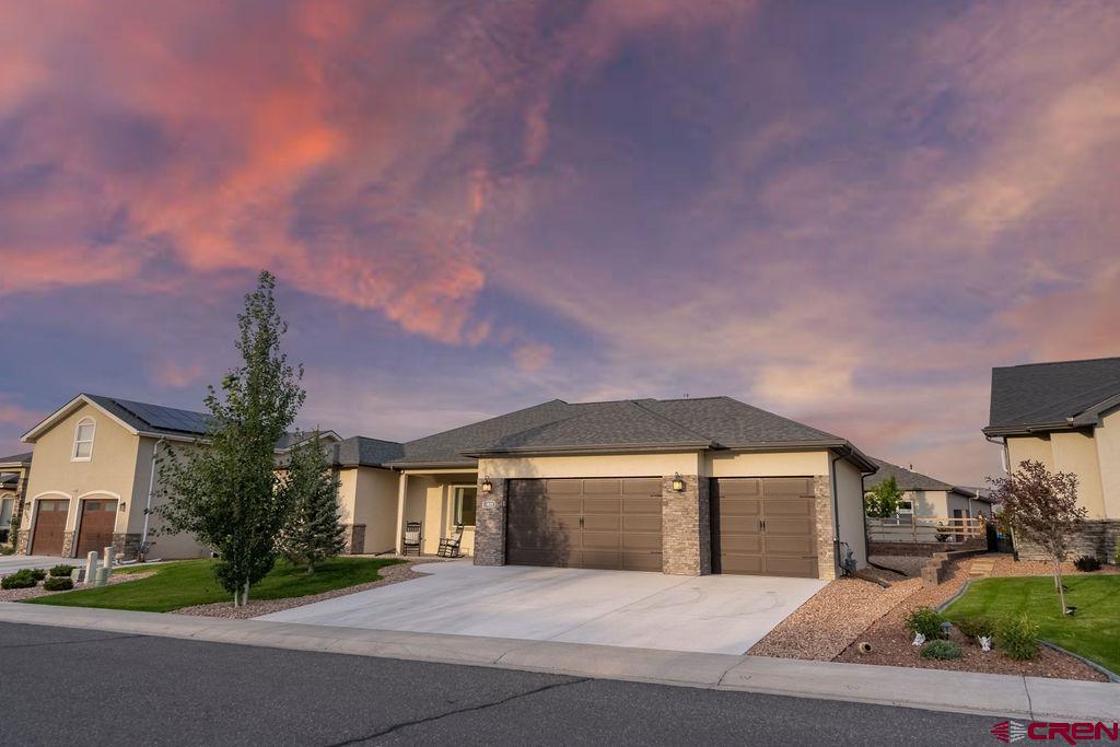 Motivated Sellers! This amazing home is BETTER THAN NEW!   Welcome home to one of the cleanest and brightest properties you’ll find in Montrose, CO! Vaulted ceilings and expansive windows flood the open living areas with natural light, showcasing rich, high-end vinyl plank flooring that flows from the covered front porch through every room. The kitchen shines with warm wood cabinets, gleaming granite countertops, and stainless-steel appliances—perfect for everyday meals or hosting friends.  Enjoy the spacious ranch floorplan that is intuitive and functional, including a primary suite with a garden tub, glass-enclosed shower, and granite-topped vanity, a second full bath and a convenient half bath offer matching finishes and practical design without upstaging the living space.  Step outside to the covered rear patio overlooking a low-maintenance xeriscaped backyard that’s ready for relaxing evenings or weekend barbecues. The meticulously maintained three-car garage provides ample storage for vehicles, tools, and outdoor gear, and it is also EV ready with an upgraded, fast, and efficient 48-amp Tesla Level 2 wall charger for quick at-home charging!   You’re just a block from Brown Ranch Park’s walking and biking trails and minutes from the Uncompahgre River for fishing or kayaking. Nearby Bear Creek and Saturday Trail systems beckon mountain bikers, and easy drives take you to Grand Mesa’s forests, Ouray’s hot springs and back-country trails, or Telluride’s world-class slopes and festivals. At 3415 Chestnut, every detail invites you to enjoy single-level convenience, a lovely, welcoming neighborhood, and world class outdoor adventures at your new doorstep!