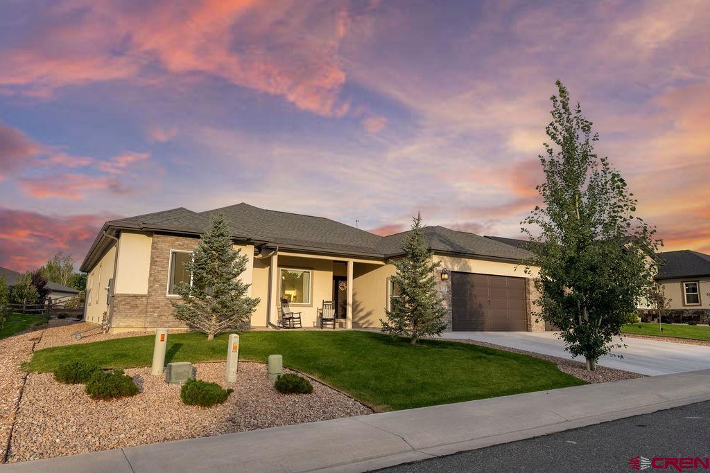 OPEN HOUSE!  Sunday August 16th, 11-1   Welcome home to one of the cleanest and brightest properties you’ll find around. Vaulted ceilings and expansive windows flood the open living areas with natural light, showcasing rich, high-end vinyl plank flooring that flows from the covered front porch through every room. The kitchen shines with warm wood cabinets, gleaming granite countertops, and stainless-steel appliances—perfect for everyday meals or hosting friends.  Enjoy the spacious ranch floorplan that is intuitive and functional, including a primary suite with a garden tub, glass-enclosed shower, and granite-topped vanity, a second full bath and a convenient half bath offer matching finishes and practical design without upstaging the living space.  Step outside to the covered rear patio overlooking a low-maintenance xeriscaped backyard that’s ready for relaxing evenings or weekend barbecues. The meticulously maintained three-car garage provides ample storage for vehicles, tools, and outdoor gear, and it is also EV ready with an upgraded, fast, and efficient 48-amp Tesla Level 2 wall charger for quick at-home charging!   You’re just a block from Brown Ranch Park’s walking and biking trails and minutes from the Uncompahgre River for fishing or kayaking. Nearby Bear Creek and Saturday Trail systems beckon mountain bikers, and easy drives take you to Grand Mesa’s forests, Ouray’s hot springs and back-country trails, or Telluride’s world-class slopes and festivals. At 3415 Chestnut, every detail invites you to enjoy single-level convenience, a lovely, welcoming neighborhood, and world class outdoor adventures at your new doorstep!