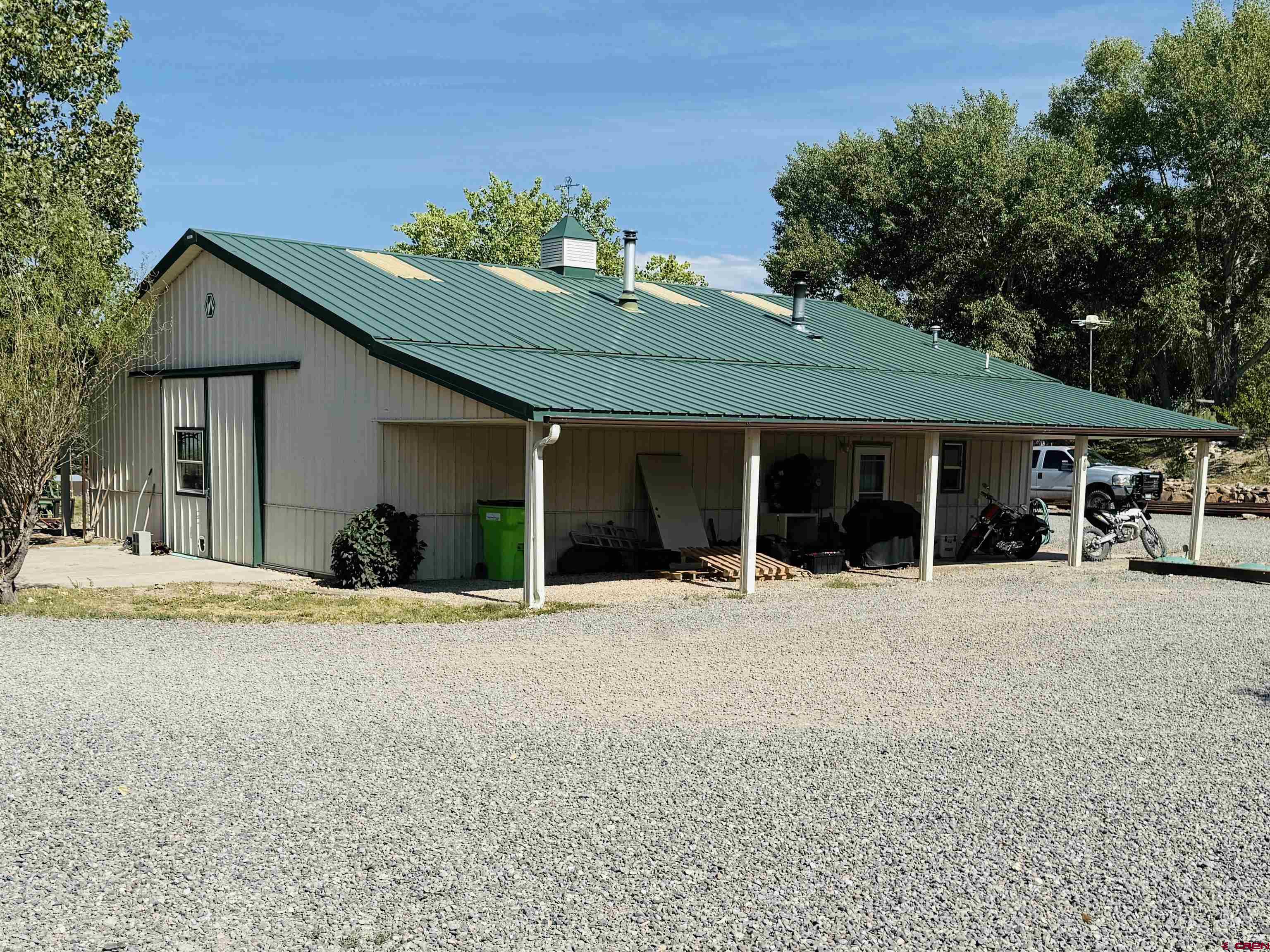 Horse property Deluxe! Close to 17 acre irrigated farm conveniently located close to town. The barn and house are up a long private driveway that offer seclusion and privacy. The house has a large covered deck that looks directly to the San Juan Mountain Range. The home is a clean and neat 3 bedroom/2 bath 1,518 sq. ft home, with a oversized 1 car garage. The home offers Anderson windows, stainless appliances, and has been updated throughout. Natural Gas furnace, central air and a wood stove! The property offers a 20x40 greenhouse that has full power. The 36x48 Morton barn offers an apt/ studio loft. with separate gas and electric meters. The apartment offers a 3/4 bath , washer/dryer, kitchen, upstairs loft bedroom, and newly updated septic. There is a full RV hookup, 2 indoor stalls with newly built steel runs and automatic waters. There are 2 smaller irrigated pastures that make great turnouts for livestock. The pole round pen/riding arena is located just to the east of the barn. Dry hay/ equipment storage building is 30x22x14 and is metal sided. If your looking for a place that offer exceptional views, peace and quiet all with a 5 min drive to town this is your place.