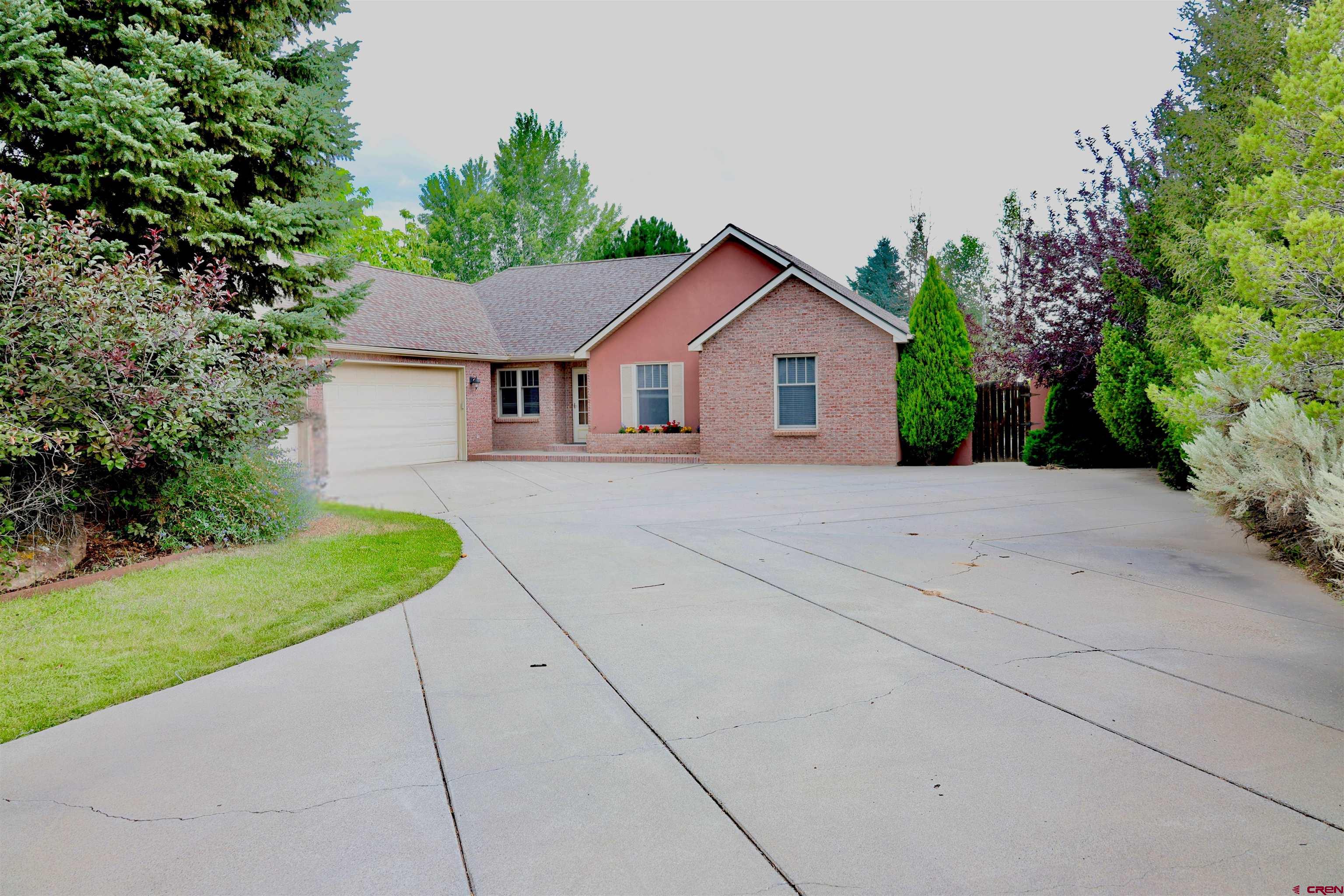 Welcome to 3924 Mt Hayden Dr, a beautiful 3-bedroom, 2-bath home with 2,206 sq ft of open-concept living on a meticulously landscaped .36-acre lot. The generously sized primary bedroom features a walk-in closet plus additional closet space and a luxurious ensuite bathroom, providing a private retreat. On the opposite side of the home, two additional bedrooms share a full bathroom, offering privacy and comfort for family or guests.  The home also includes an inviting entryway and a bonus room that could easily serve as a fourth bedroom or home office, adapting to your lifestyle needs. Enjoy cozy evenings by the double-sided gas fireplace connecting the living area to the exquisite formal dining room, perfect for entertaining. Step outside to the covered back patio, surrounded by mature trees and a fenced yard, offering a serene and private outdoor space.  Included with the home is a prestigious Cobble Creek Club membership, just a short walk to the clubhouse, featuring a full-service bar and restaurant, spa, yoga studio, gym, pro shop, and golf simulator. Miles of scenic bike trails and single-track paths connect directly to the neighborhood, allowing you to embrace an active lifestyle with breathtaking vistas—without the crowds or hassle.  Experience Montrose’s unmatched weather and seasonal beauty, year-round golf opportunities, and a lifestyle that combines luxury, recreation, and tranquility. This home is more than a residence—it’s your gateway to the ultimate Colorado lifestyle. New Carpet being installed soon! The Club membership costs about $171.67/month in addition to the HOA fees.
