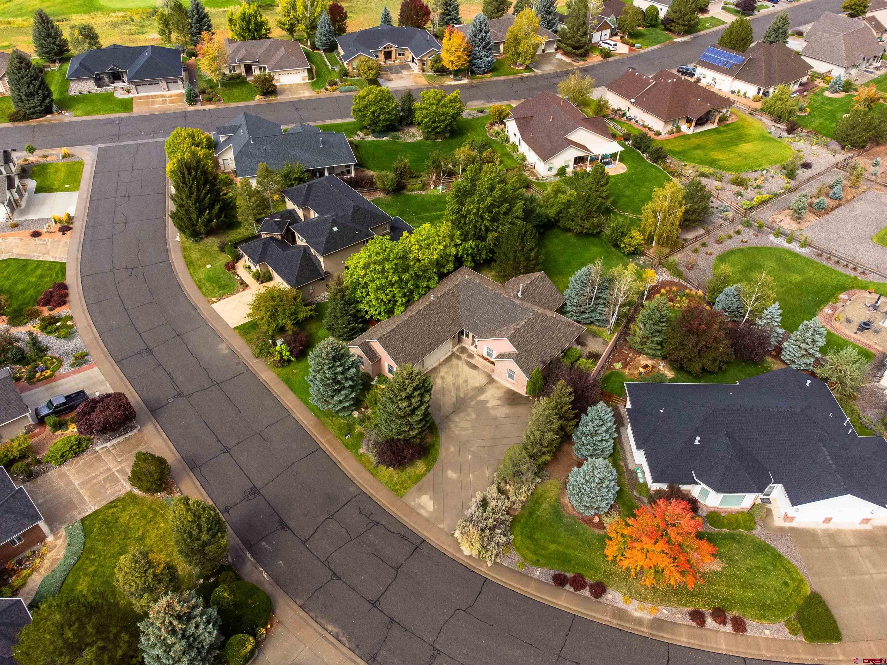 Welcome to 3924 Mt Hayden Dr, a beautiful 3-bedroom, 2-bath home with 2,206 sq ft of open-concept living on a meticulously landscaped .36-acre lot. The generously sized primary bedroom features a walk-in closet plus additional closet space and a luxurious ensuite bathroom, providing a private retreat. On the opposite side of the home, two additional bedrooms share a full bathroom, offering privacy and comfort for family or guests.  The home also includes an inviting entryway and a bonus room that could easily serve as a fourth bedroom or home office, adapting to your lifestyle needs. Enjoy cozy evenings by the double-sided gas fireplace connecting the living area to the exquisite formal dining room, perfect for entertaining. Step outside to the covered back patio, surrounded by mature trees and a fenced yard, offering a serene and private outdoor space.  Included with the home is a prestigious Cobble Creek Club membership, just a short walk to the clubhouse, featuring a full-service bar and restaurant, spa, yoga studio, gym, pro shop, and golf simulator. Miles of scenic bike trails and single-track paths connect directly to the neighborhood, allowing you to embrace an active lifestyle with breathtaking vistas—without the crowds or hassle.  Experience Montrose’s unmatched weather and seasonal beauty, year-round golf opportunities, and a lifestyle that combines luxury, recreation, and tranquility. This home is more than a residence—it’s your gateway to the ultimate Colorado lifestyle. New Carpet being installed soon! The Club membership costs about $171.67/month in addition to the HOA fees. Some photos of this listing may include virtually staged amenities, furniture or fixtures.