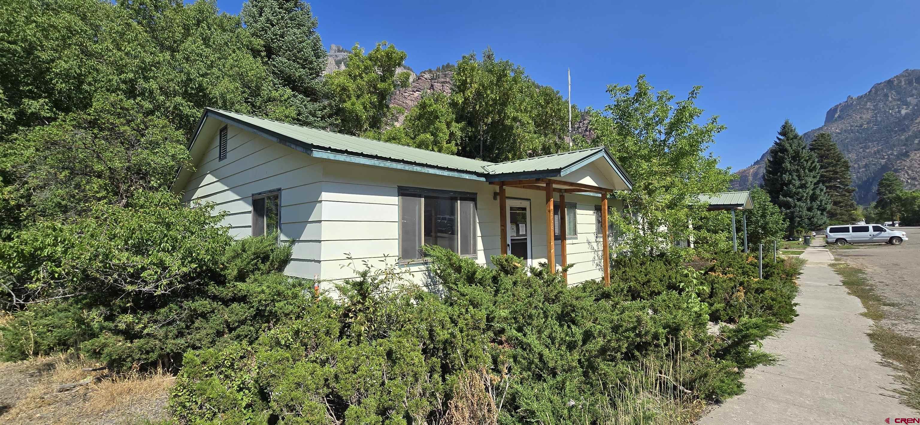 This is the former public health building in the City of Ouray. Property is in the R2 zone which allows multi-family usage. There is one 3/4 bath and one 1/2 bath. The layout is set up for multiple exam rooms. There are two separate entrances. The property is served with propane. There is biologic activity in the building which has not been analyzed. All entrants are advised to wear protective gear. Seller has not tested for any issues and has no direct knowledge of the condition of the property. Property is being sold AS-IS.