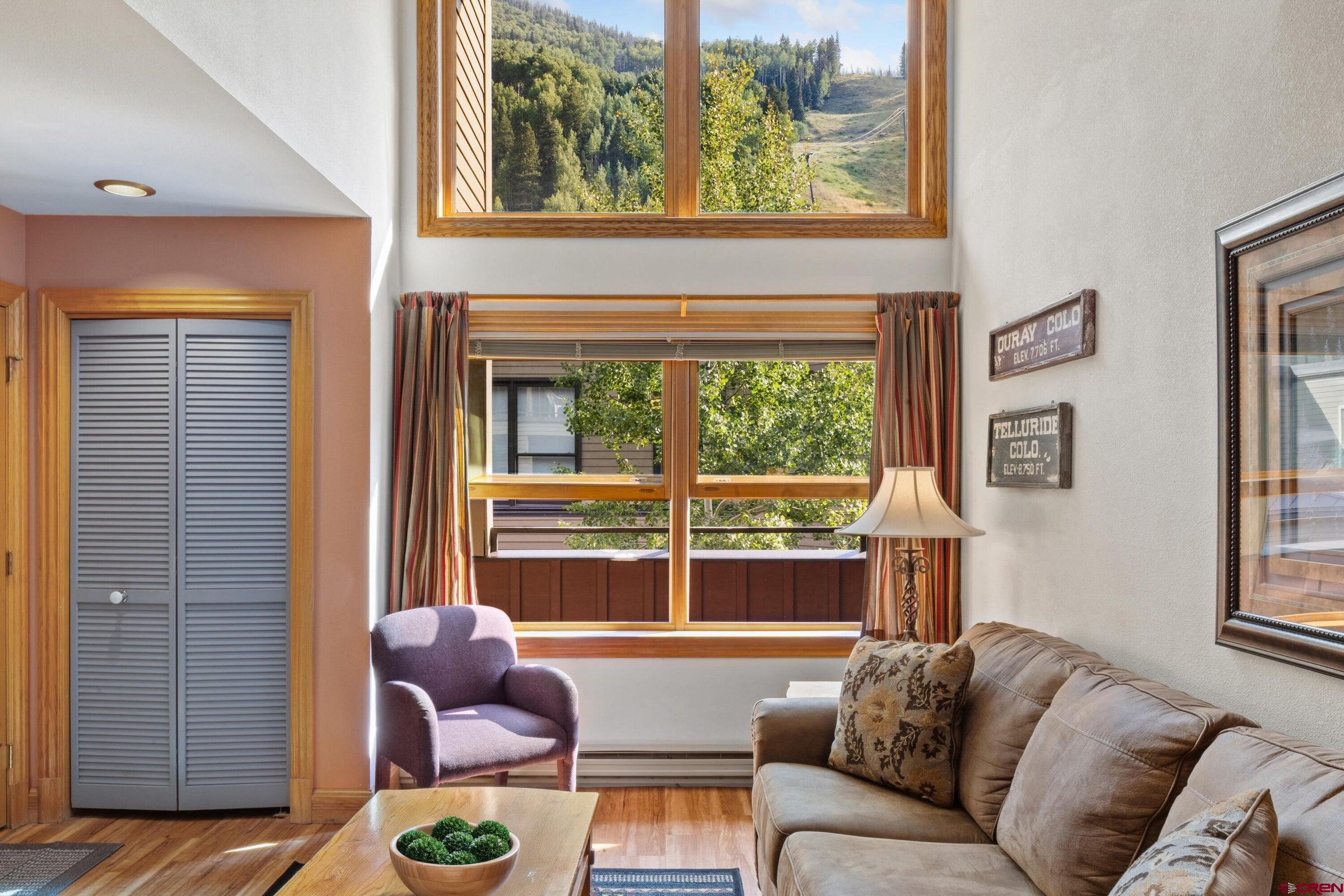 Enjoy breathtaking ski mountain views from this cozy 2-bedroom, 2-bath condo with a true ski in/ ski out location at Lift 7. The main level features an open living/kitchen/dining area with vaulted ceiling. The guest bedroom at the rear has scenic views of the north canyon wall and the San Miguel River...perfect for falling asleep to the sound of flowing water. The main bathroom has been updated with travertine tile and a modern rolling glass shower door. Upstairs, the private master suite has a walk-in closet and opens to a 110 sq.ft. balcony with views extending east to Mt. Ballard. Heated underground parking garage with bike storage. Cimarron is the site of the original base area for the Telluride Ski Resort. This is an incredible value for some of most prime real estate in ski country!