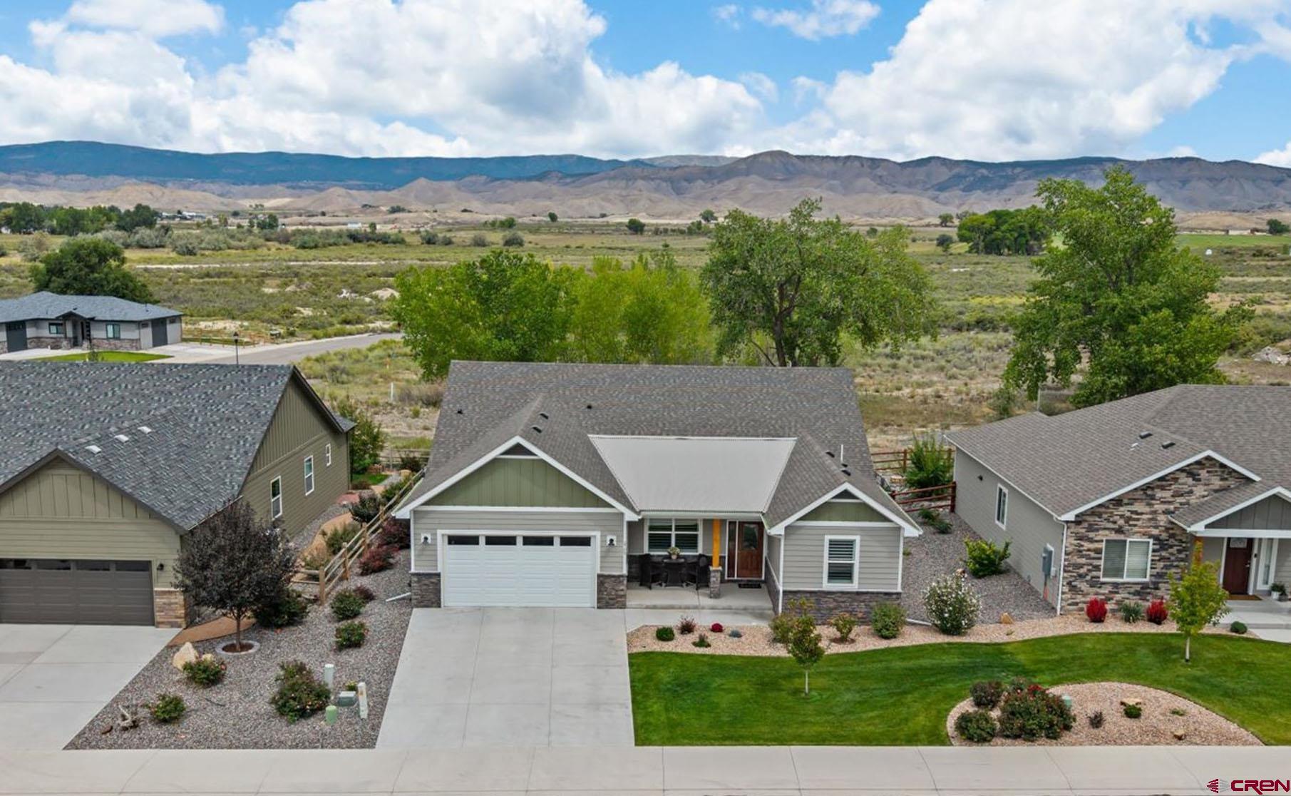 LOCATION: Welcome to one of Colorado's best locations, just far enough from the mountains to have great views of the amazing San Juan Range, with quick access to everything Montrose has to offer. To the south is beautiful Ridgway State Park, the Town of Ridgway, Town of Ouray, set within the stunning San Juans.  West is Telluride, and east is the spectacular Black Canyon National Park. This home is located on a cul-de-sac in the wonderful Brown Ranch community, a quiet neighborhood that really feels like Colorado, with a park, open spaces, and walking paths. INSIDE: This well-built home was constructed by one of the most respected area builders, features: 3-zone climate control, 9' ceilings, Minke Aire fans throughout, coat closet, Corian window sills, an 18' long beautiful yet understated tile backsplash in the large kitchen, spacious pantry, a very roomy and thoughtful open floor plan, with plenty of space for you to customize to your own taste. This much like new home includes the following improvements: Hunter Douglas bi-level shutters in the front windows and HD top-down bottom-up blinds in the great room.  Neutral window shades throughout. Two contemporary Minke Aire ceiling fans in the great room. Fireplace sitting area cabinets refinished to closely match the kitchen. The split floor plan features a very large 21x15' master suite, with two walk-in closets, and walk out to the 34' wide patio.  The master bath has a generous vanity and roomy shower including a built-in bench. The neutral paint and floors are ready for any colors you want to bring into the home. OUTSIDE: Most of the trees behind the home turn a long lasting and glorious golden yellow in the fall. Lush grass in front and behind the home is watered and maintained by the HOA, allowing for worry-free vacations and/or part-time residency. Snow removal for the front of the home is also handled by the HOA. There's plenty of room out back for all of your patio furnishings, for viewing sunrise over the mountains and enjoying cooler east facing evenings.  The fenced back yard keeps the deer in view, but out of your garden. Amazing views of the San Juan range are seen from the neighborhood's paved walking path.  Brown Ranch incorporates open space within its development and is the ideal location for those looking for a tranquil setting while preserving the convenience of quick access to the best amenities in Montrose.