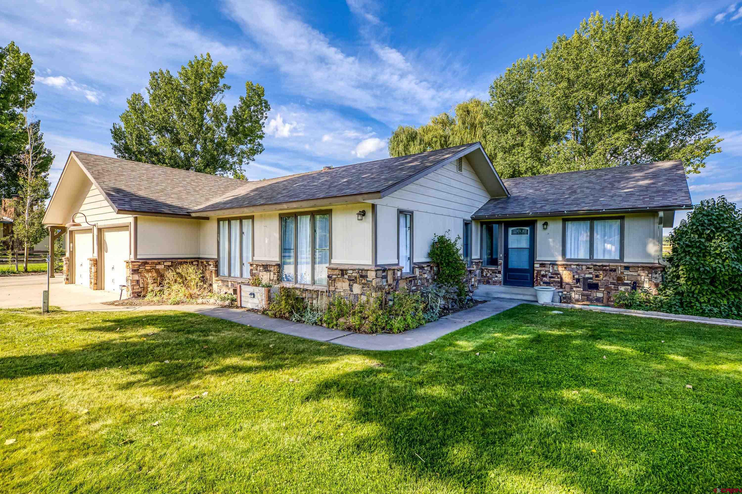 Nestled on a quiet cul-de-sac in the desirable Spring Creek Estates neighborhood, this 3-bedroom, 2-bath home is truly turnkey and ready for its next chapter. Recent updates include new flooring throughout, fresh interior paint, new exterior doors, garage floor epoxy, washer and dryer, an updated vanity in the primary suite, and refreshed landscaping. Outdoors, you’ll love the thoughtful touches and room to spread out. The property boasts fruit trees, mature shade trees, established gardens, a barn with fenced corral, chicken coop with loft, and a handy storage shed—ideal for hobbies, homesteading, or simply enjoying the Colorado lifestyle. With its blend of modern updates, natural beauty, and neighborhood charm, this Spring Creek Estates property offers comfort, convenience, and room to grow.