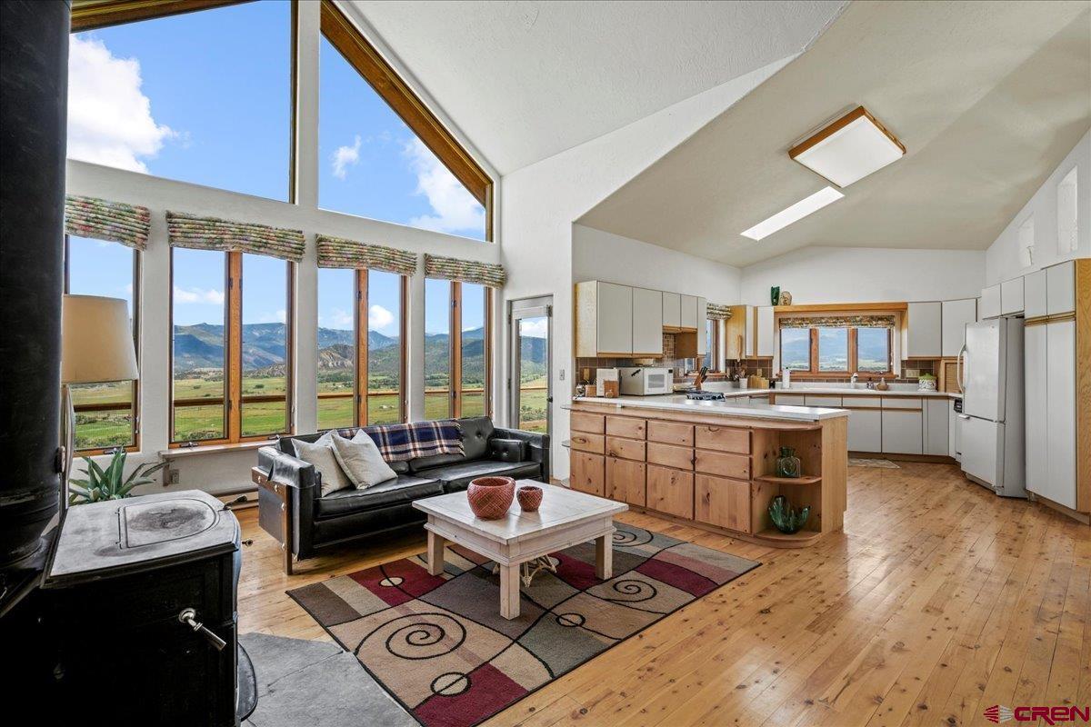 When you think of Colorado and your dream home, it is about the mountain views.   You want a home with the BIG mountain views.   What does that mean?  You want to see Mt Sneffels framed by your living room windows.  You want to see all of the San Juans and all of the Cimarron Mountains.   You want to see Chimney Peak and the Courthouse turn yellow, orange, pink, lavender with the evening Alpenglow.   This Pleasant Valley home with 3 bedroom, 2 baths, and is located on 39 very private acres.  No HOA and no covenants.  Paved access.   Perfect setting to take advantage of a solar energy system. Enjoy this special setting, and its proximity to Ouray, Telluride, Montrose, the Cimarron and San Juan Mountains.  It is a location close to where you want to go.  10 mins to the Town of Ridgway, 40 minutes to Telluride, less than an hour to the Montrose Airport.    Hike, bike, walk, run right from your front door.