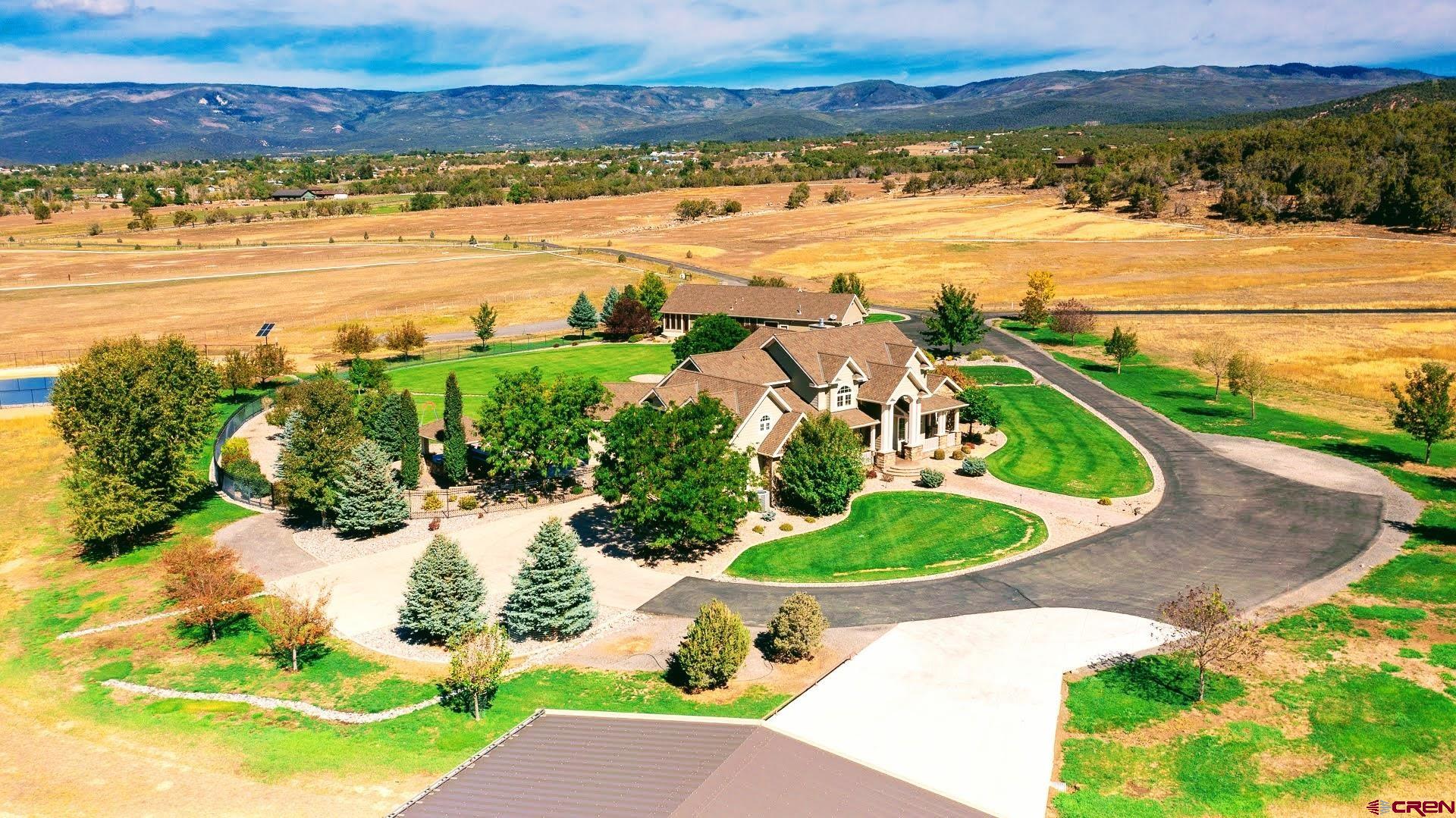 Stunning 2-Home 35-Acre Luxury Country Estate in Cedaredge! Situated just outside of the Trending Charming Mountain Valley Town of Cedaredge, at the foot of the Grand Mesa, lies a Truly Magnificent 35-acre Luxury Country Estate. With Sweeping Views of the Grand Mesa and Picture-perfect Colorado sunsets, this Property is the Epitome of Elegance, Comfort and Timeless Craftsmanship. A stately Half-Mile-Long Paved Driveway leads you into the Estate, Setting the Stage for the Privacy, Beauty and Grandeur that Awaits Within. Both the Main Residence and the Guest Home were Masterfully Designed and Built by one of the Region’s Most Respected Builders, with No Expense Spared. Every Detail was Carefully Considered to Create a Property that Balances Cutting-Edge Technology with Enduring Style. Inside the Homes, you’ll find Exquisite Hardwood Walnut Floors, Fine Tile and Silk Carpets in the Bedrooms. High-End Appliances, a Whole-House Sonos Sound System inside and out, Automated Blinds, Accent Lighting, and an Advanced Indoor/Outdoor Lighting System all speak to the property’s thoughtful Integration of Luxury and Convenience. The Exterior Showcases Hardie Plank and Stone Siding for Enduring Beauty. The Main Home’s Courtyard is an Entertainer’s Dream. This Private Retreat features an In-Ground “Sport’s” Swimming Pool, Hot Tub, Firepit and an Outdoor Kitchen with a Built-in Barbecue, 2-Burner Grill, Built-In Ice Chest, and even a Built-in TV that Disappears with the Touch of a Button, All Designed to Maximize Relaxation and Enjoyment in Every Season. An In-House Humidifier Further Enhances Year-Round Comfort. Supporting the Estate’s Lifestyle and Functionality are Infrastructure features, including Two USCDWUA Water Taps, Two Septic Systems and Valuable Irrigation Rights. A Solar-Powered Pump draws from an Irrigation Well and Pond to Nourish the Beautifully Maintained Grounds. For Storage, Hobbies or Adventure, a Massive 48' x 44' 3-bay Workshop/RV building Easily Accommodates RVs, Equipment, and All Manner of Toys. This Property Embodies the Best of Colorado living—a Rare and Refined Estate that Seamlessly Blends Luxury, Privacy and Practicality in an Unmatched Mountain Valley Setting. Seller has 2 other 35-Acre Adjacent Parcels, of which either one or both could be purchased with this property, but cannot be sold separately until this property is sold.