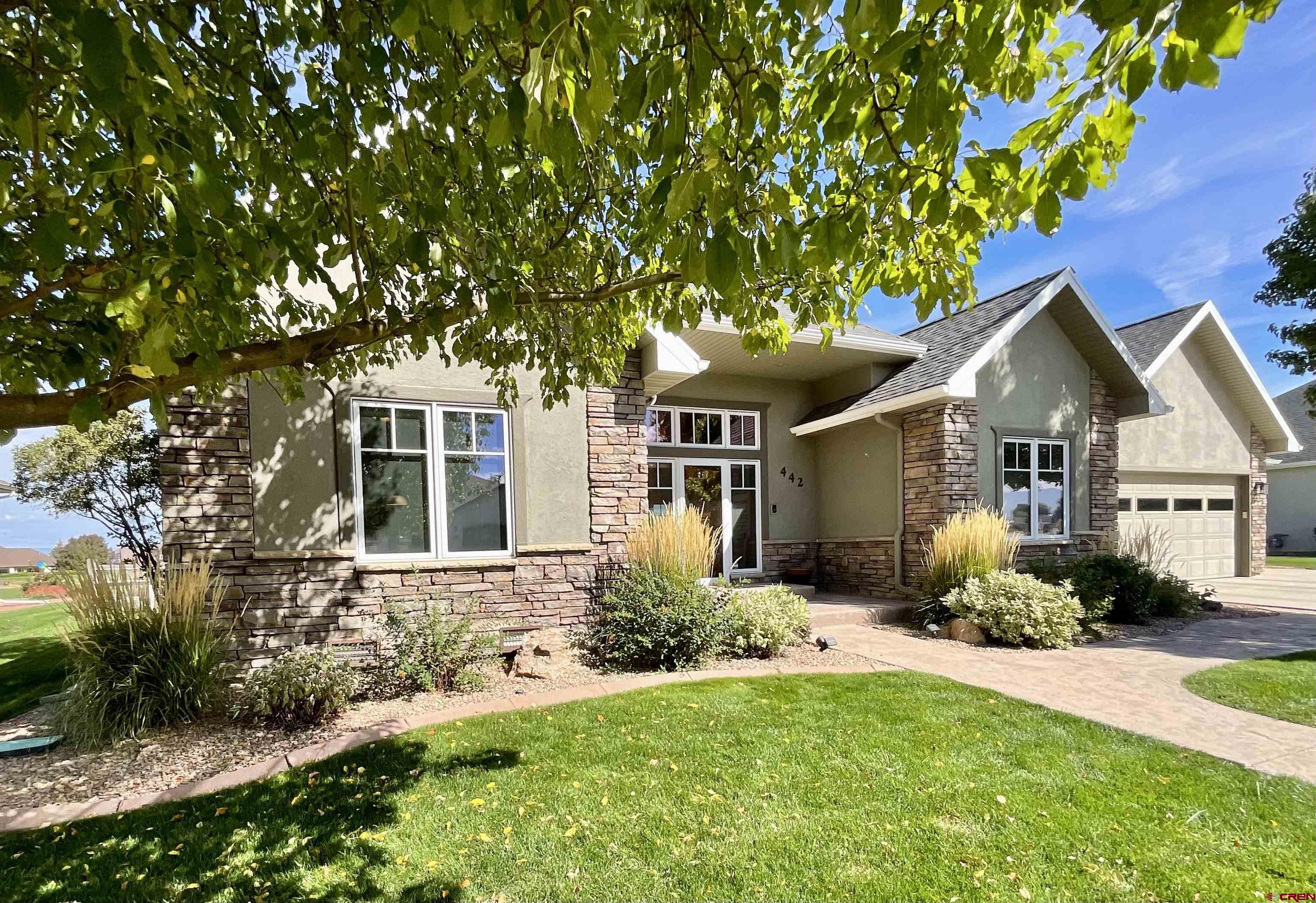 Welcome to Cobble Creek Golf Community in beautiful Montrose, Colorado! This stunning 2,130 sq. ft. home combines comfort, style, and thoughtful design. Featuring 3 bedrooms, 2.5 baths, and a vaulted living room ceiling with a cozy gas fireplace, this home is perfect for both relaxing and entertaining.  The custom kitchen is a chef’s delight, offering granite countertops, stainless steel appliances, a beverage refrigerator, and a charming breakfast nook with views of the backyard and golf course. A formal dining room adds an elegant touch, while a spacious bonus room upstairs provides the ideal space for a private office or guest suite.  Step outside to your own retreat—double doors from the living room open to a large patio with a hot tub, overlooking the 16th hole and capturing breathtaking views of the Grand Mesa to the north. The fenced backyard and meticulously maintained landscaping create a private, serene setting.  Additional features include a 3-car garage with attic storage accessible by pull-down ladder, complete with an electric pulley system for heavier items. The home is equipped with surround sound throughout, security system and ring camera.   This home blends golf course living with everyday comfort—don’t miss the opportunity to make it yours!
