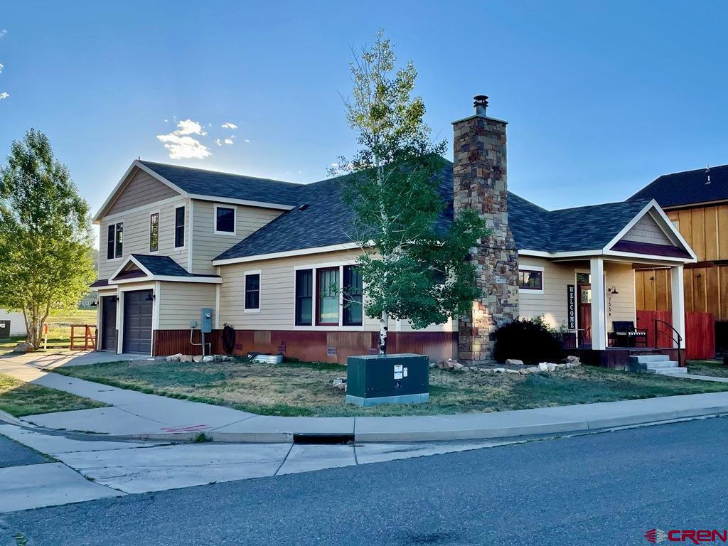 Custom Home in Premier Ridgway Neighborhood Located on a desirable corner lot, this spacious custom home offers mature landscaping, a fenced side and backyard, and inviting outdoor living spaces.   The gourmet kitchen is a true highlight, featuring a 36" Wolf duel fuel range with oversized, stainless steel Wolf range hood and complete suite of KitchenAid stainless steel appliances, including refrigerator/freezer, dishwasher, microwave, warming drawer, and ice machine. A large center island, granite countertops, custom cabinetry, and elegant built-ins make this kitchen as functional as it is beautiful. Generously sized bedrooms all include walk-in closets, while the versatile 4th bedroom/bonus room provides abundant storage and can serve as a recreation room, guest suite, or office. Hardwood floors, natural stone tile and abundant natural light enhance the home's warm and inviting atmosphere.  Additional features include central heat and air, plentiful storage and a 3 car garage. This property combines luxury and practicality in one of Ridgway's most sought-after neighborhoods- an ideal place to call home.