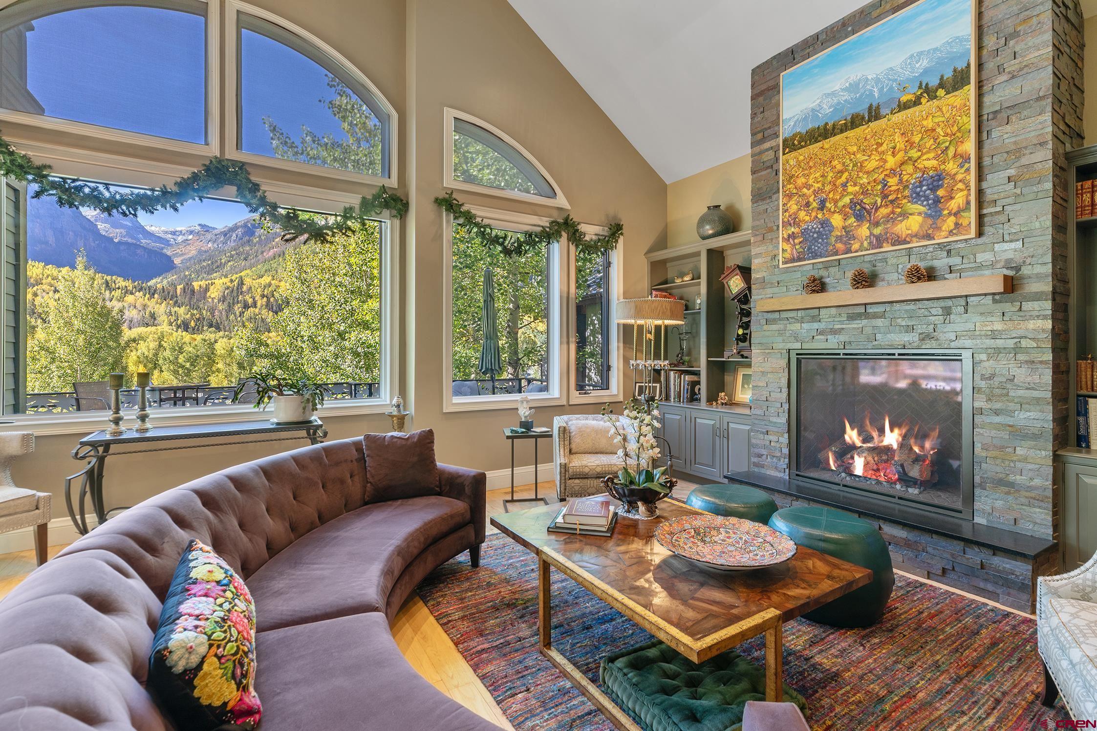 The most amazing uninterrupted views of Bear Creek Canyon and all surrounding mountains make this home one of a kind. Meticulously cared for and updated, you can enjoy the views from large windows on every floor and two large south facing decks. This very beautiful home spans both Columbia and Pandora Avenues. Enter this wonderful home from the quiet E. Pandora Avenue but the 2 car heated garage entrance is on Columbia with 4 off street parking spaces
